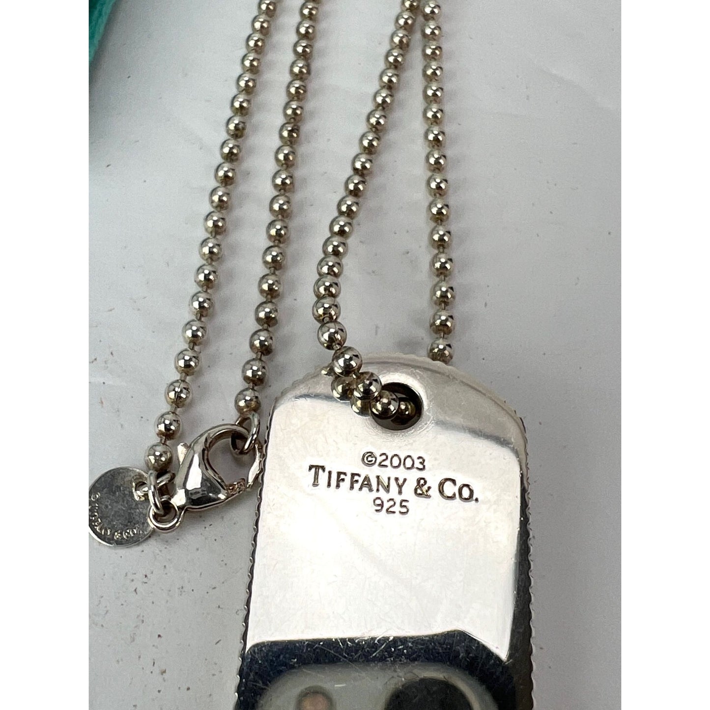 
                  
                    Tiffany Sterling Silver Dog Tag Pendant on Sterling Silver Chain Necklace
                  
                