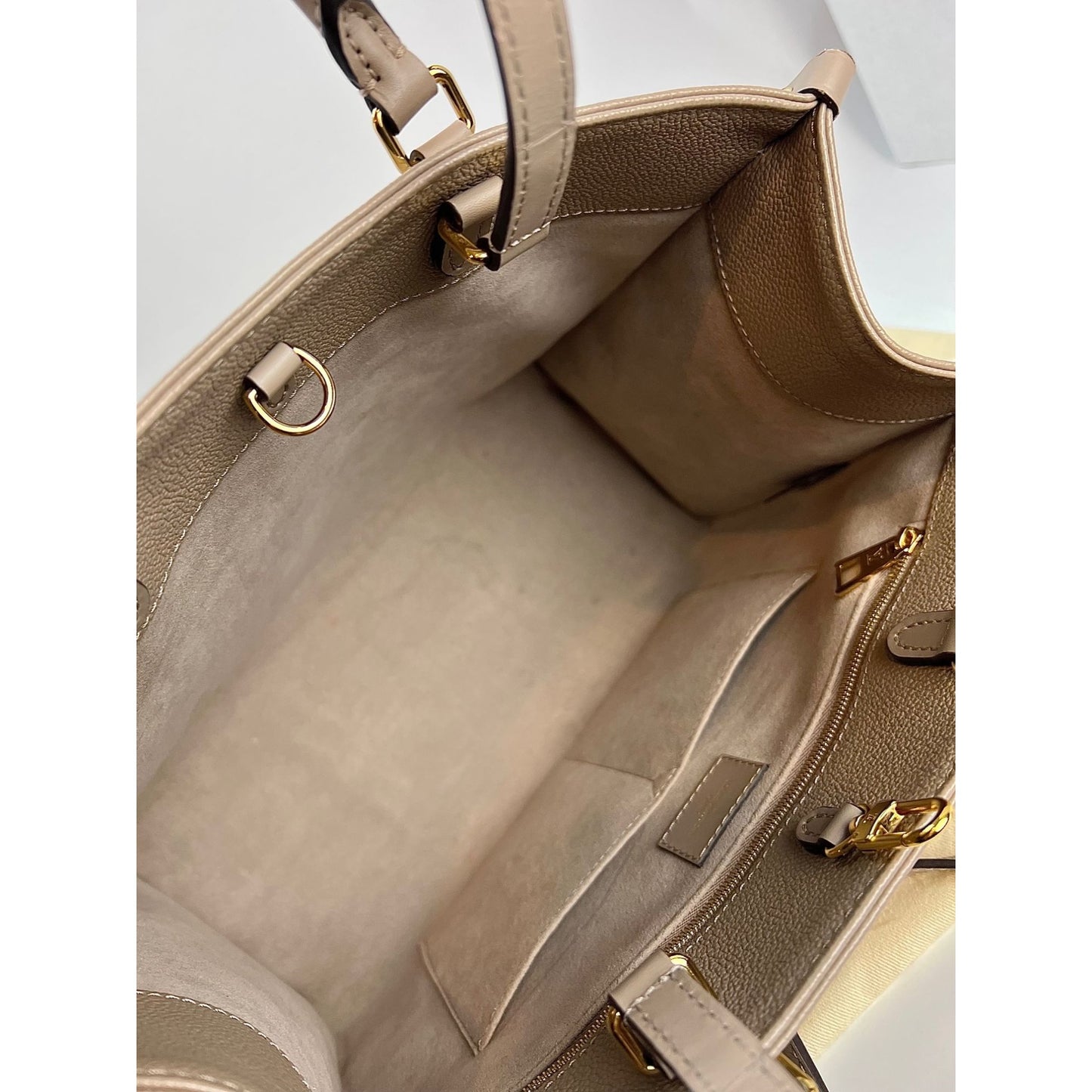 Louis Vuitton on The Go mm, Beige, One Size
