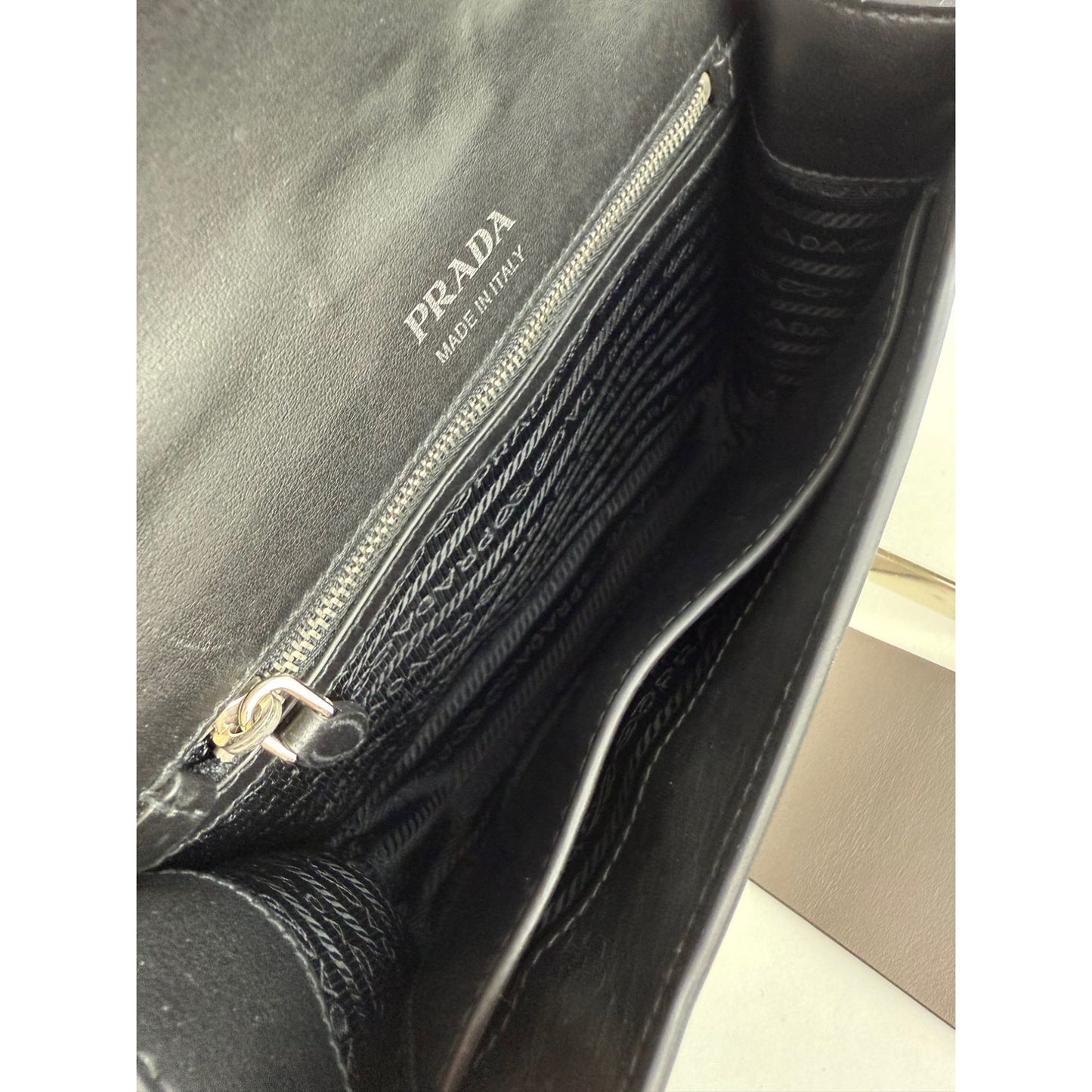 
                  
                    Prada Cahier Beige Gray Calfskin Leather Crossbody Clutch Bag
                  
                