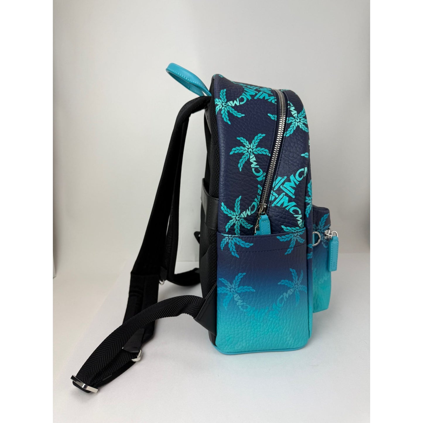 
                  
                    MCM Stark Ceramic Blue Gradation Palm Canvas Backpack
                  
                