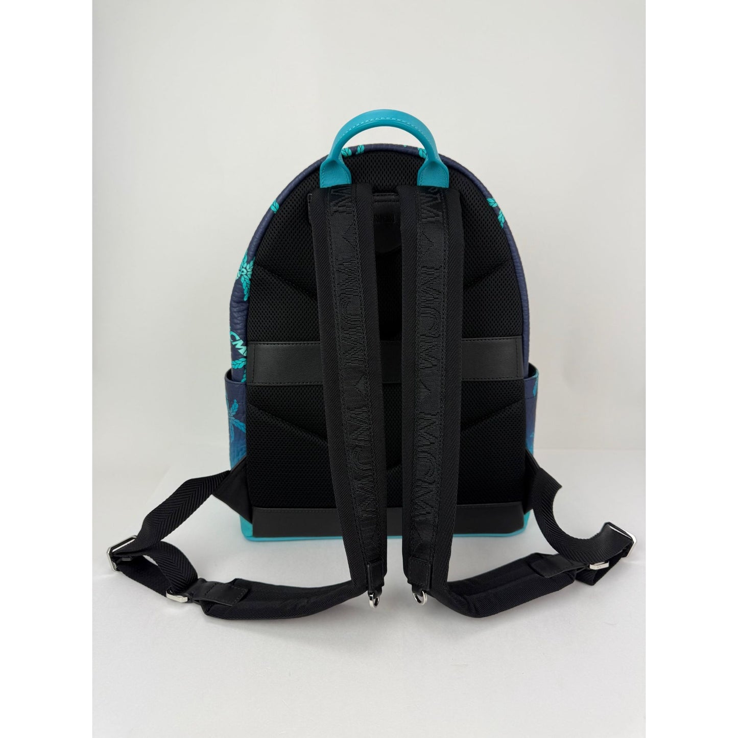 
                  
                    MCM Stark Ceramic Blue Gradation Palm Canvas Backpack
                  
                