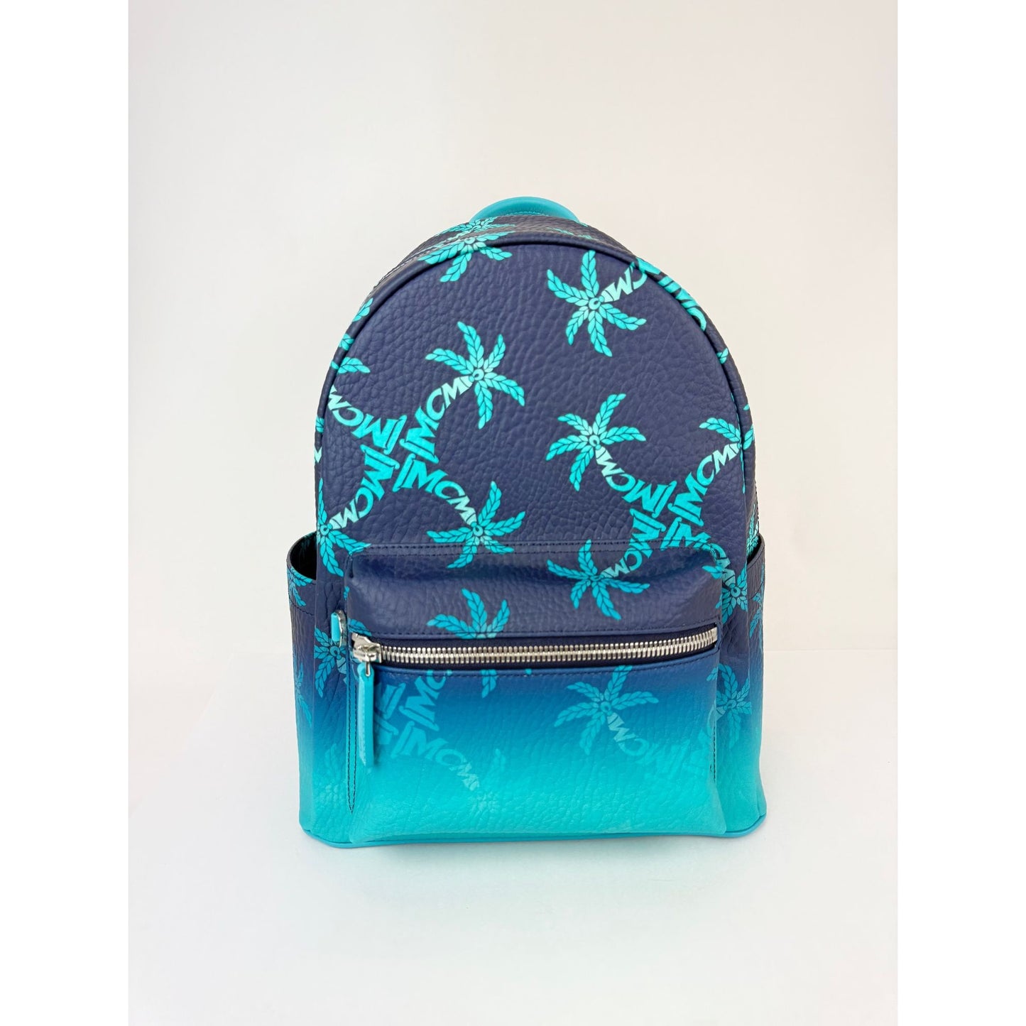 
                  
                    MCM Stark Ceramic Blue Gradation Palm Canvas Backpack
                  
                