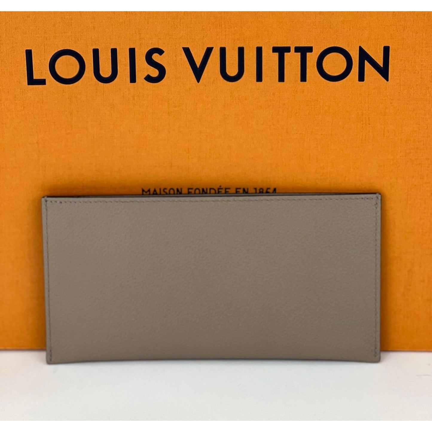 Louis Vuitton receipt for proof that it is real.