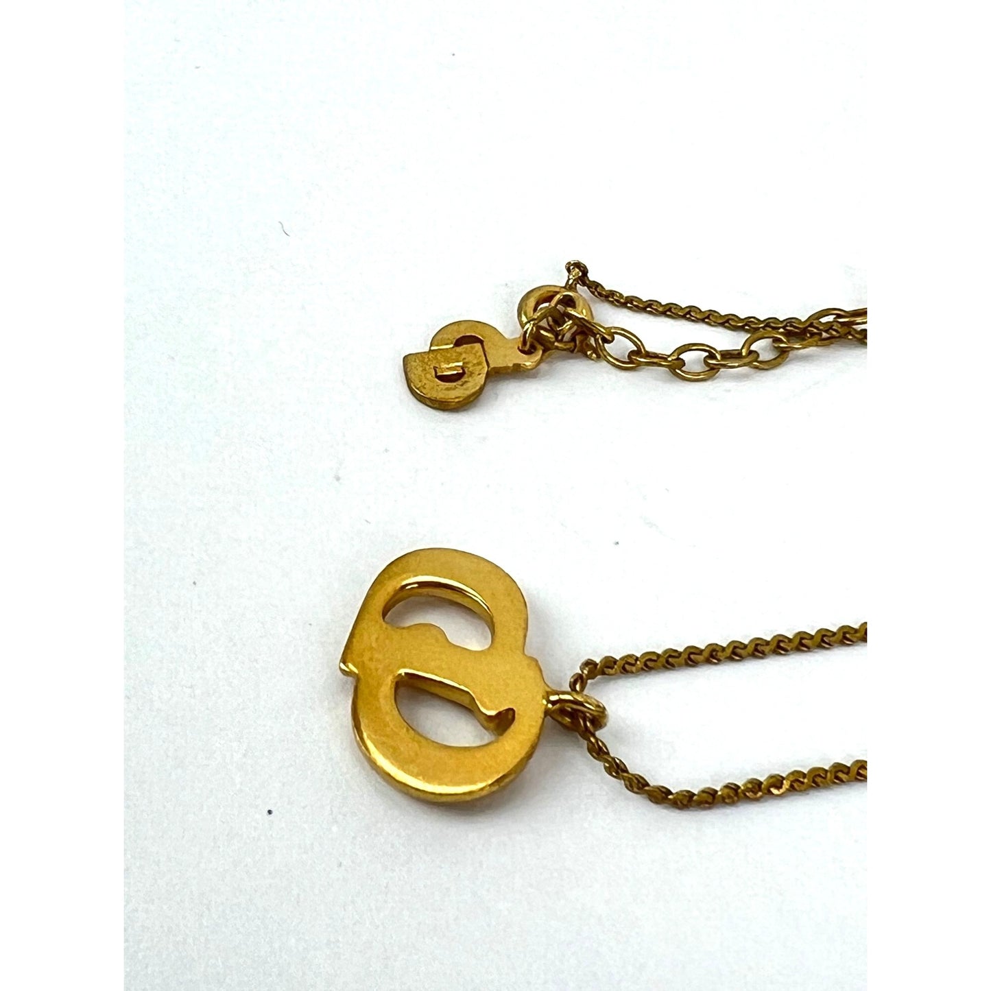 
                  
                    Christian Dior Gold Plated CD Pendent Necklace
                  
                