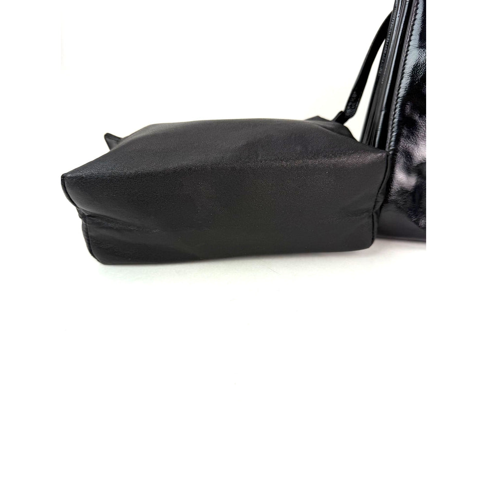 
                  
                    Chanel Patent Mademoiselle lock Convertible Wrist Clutch Black Bag
                  
                