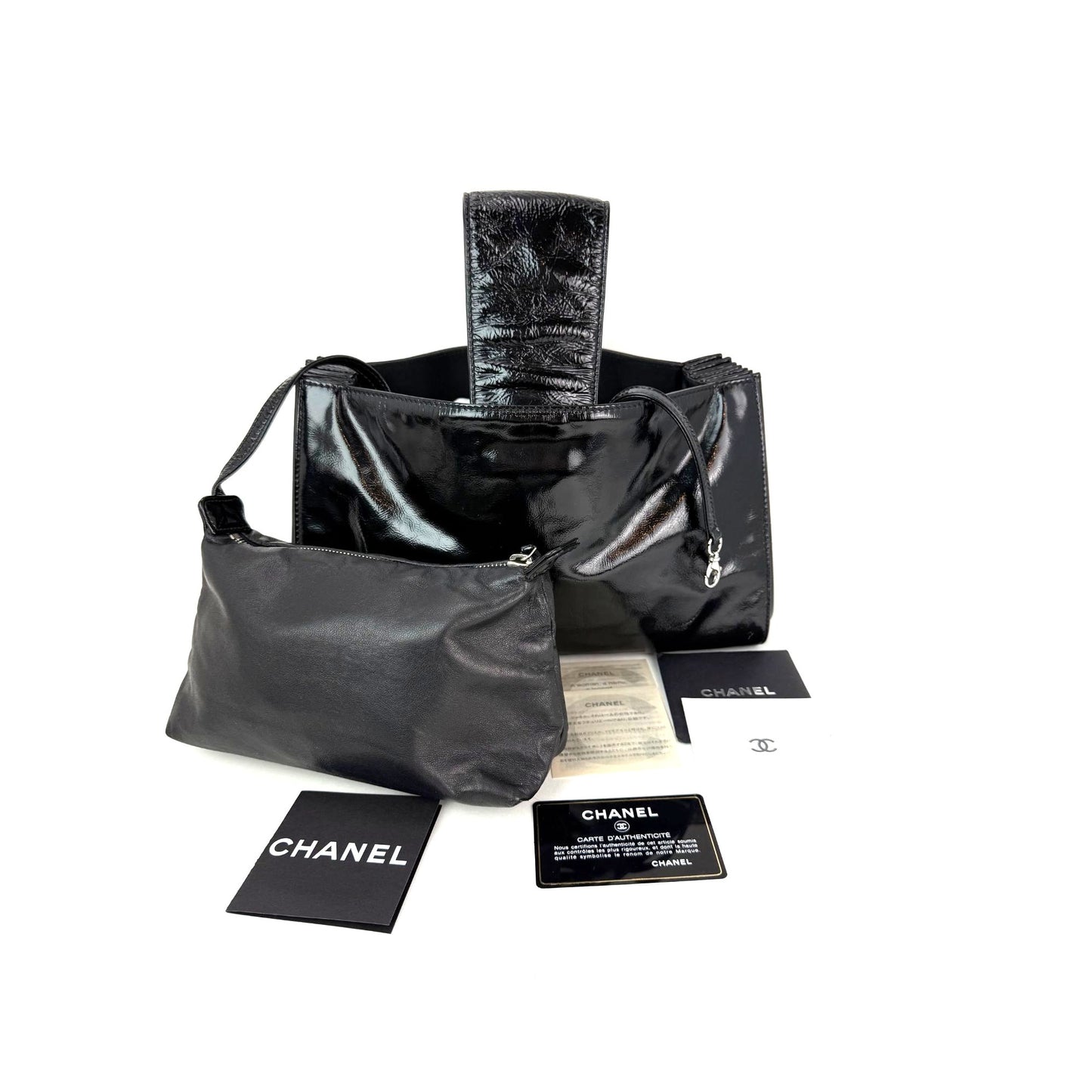 
                  
                    Chanel Patent Mademoiselle lock Convertible Wrist Clutch Black Bag
                  
                
