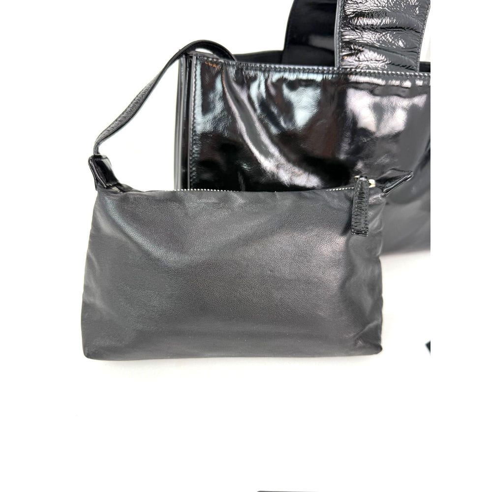 
                  
                    Chanel Patent Mademoiselle lock Convertible Wrist Clutch Black Bag
                  
                