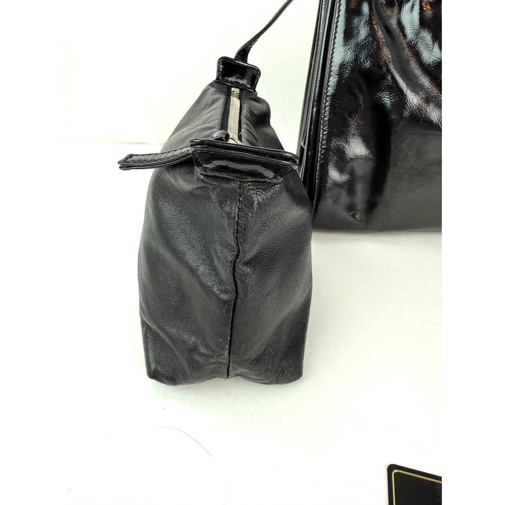 
                  
                    Chanel Patent Mademoiselle lock Convertible Wrist Clutch Black Bag
                  
                