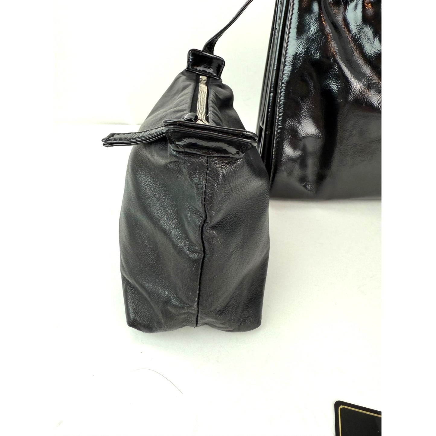 
                  
                    Chanel Patent Mademoiselle lock Convertible Wrist Clutch Black Bag
                  
                