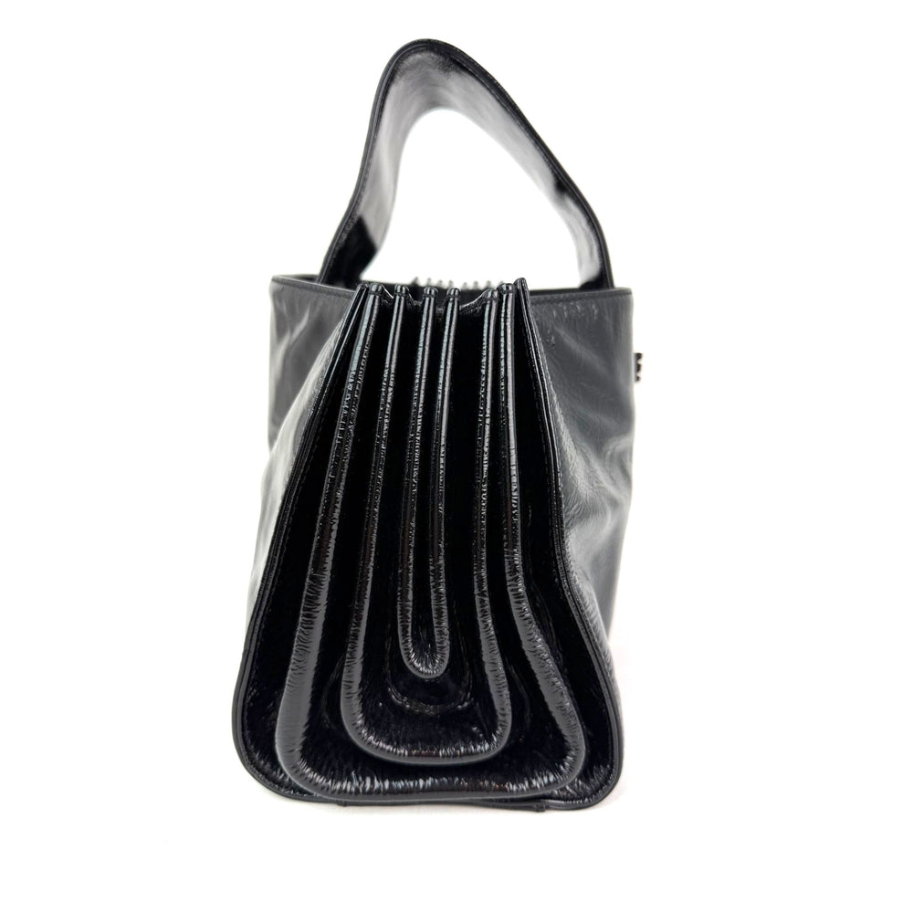 
                  
                    Chanel Patent Mademoiselle lock Convertible Wrist Clutch Black Bag
                  
                