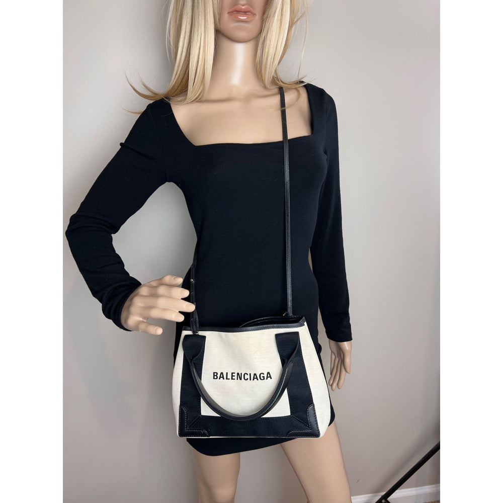 
                  
                    Balenciaga Cotton Canvas Calfskin Navy Cabas XS Natural Black Tote Bag
                  
                
