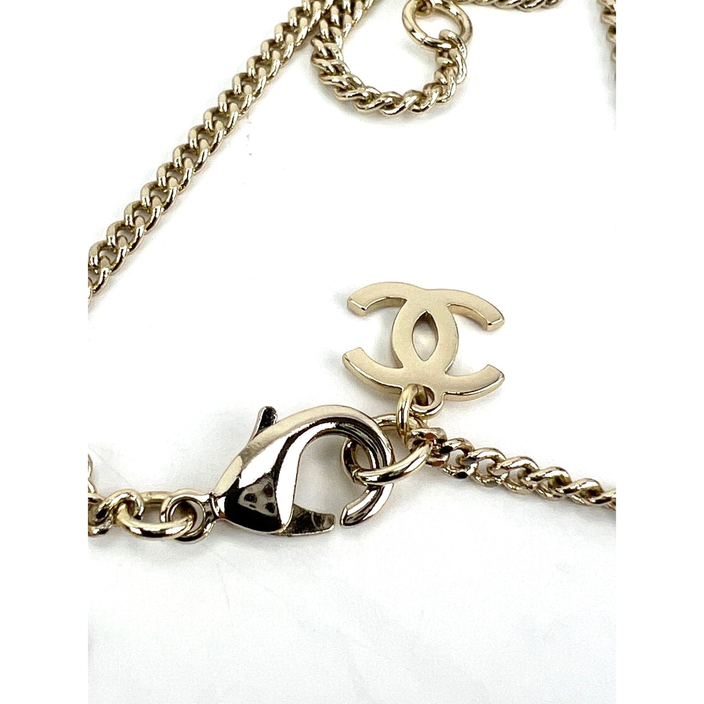 
                  
                    Chanel Gold Tone CC Pearl Crystal Pendant Necklace
                  
                