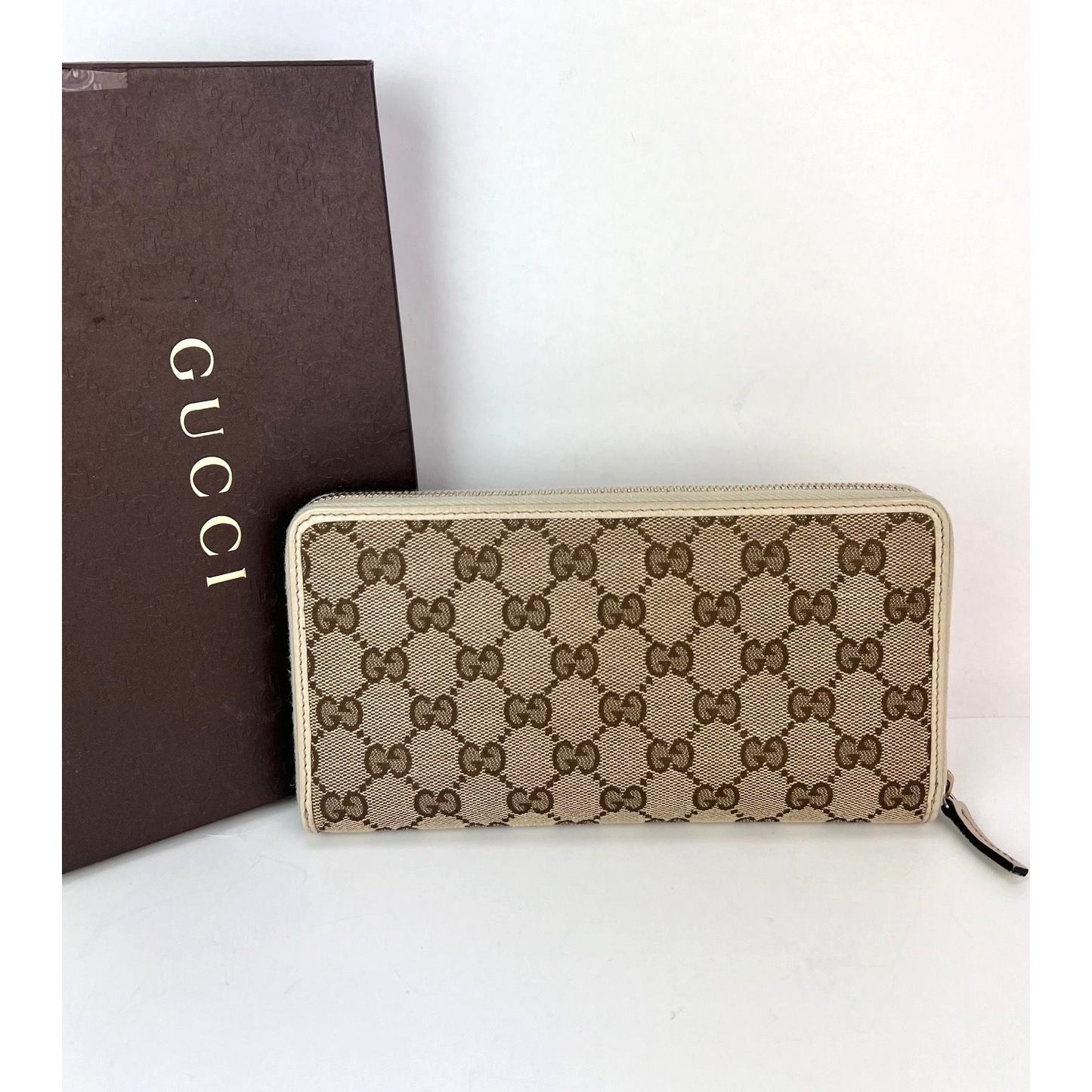 
                  
                    Gucci GG Logo Beige Zip Around Canvas Long Wallet
                  
                