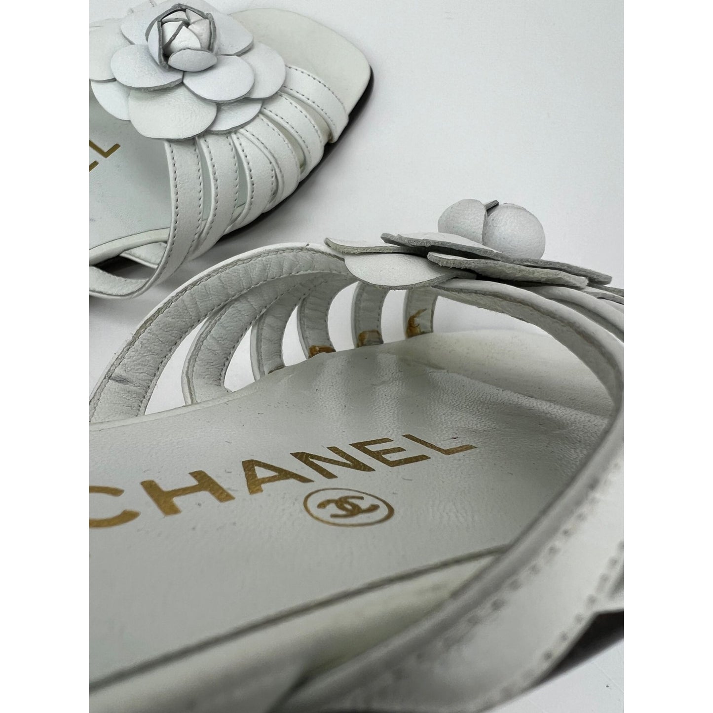 
                  
                    Chanel Cameilla White Leather Slip On Sandals
                  
                