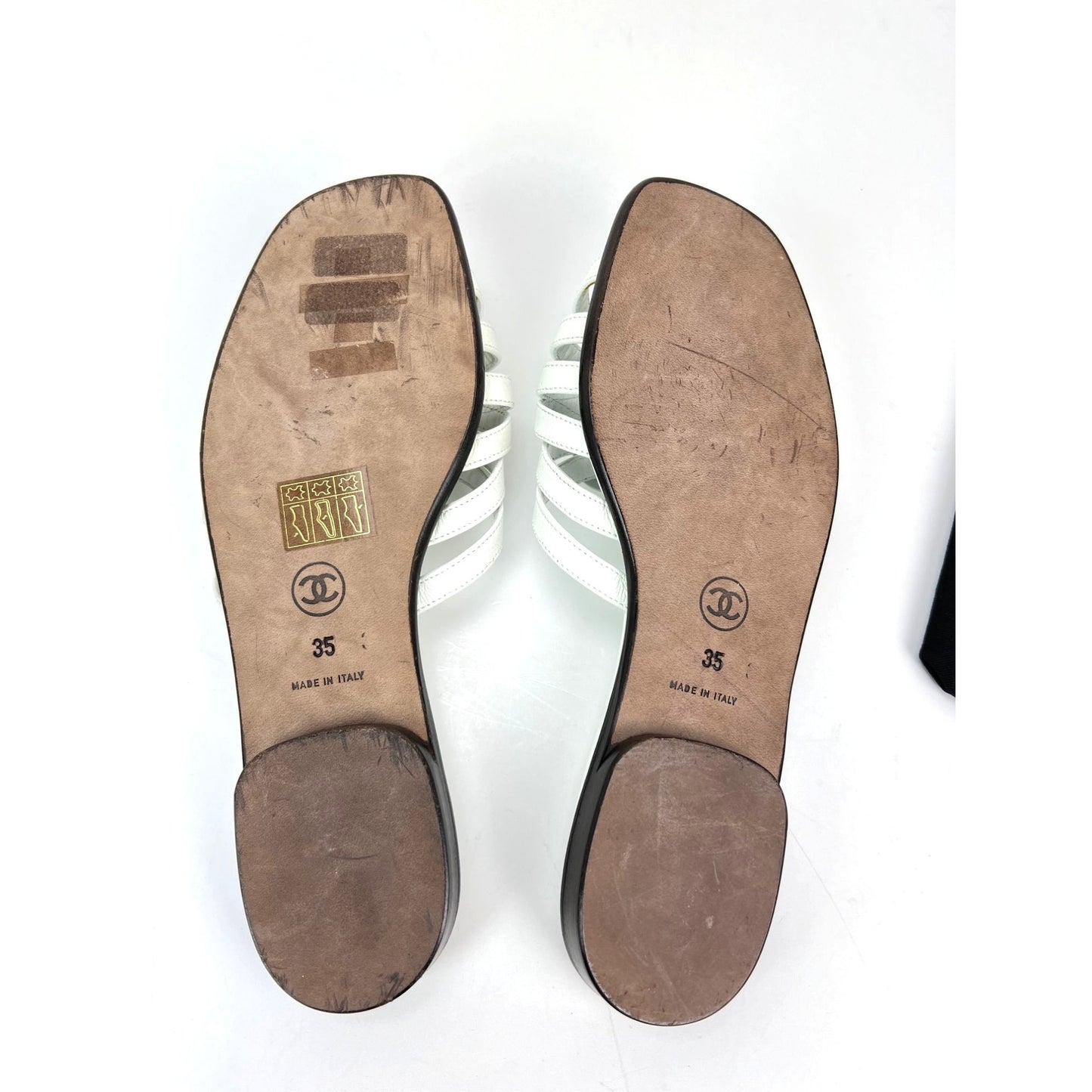 
                  
                    Chanel Cameilla White Leather Slip On Sandals
                  
                