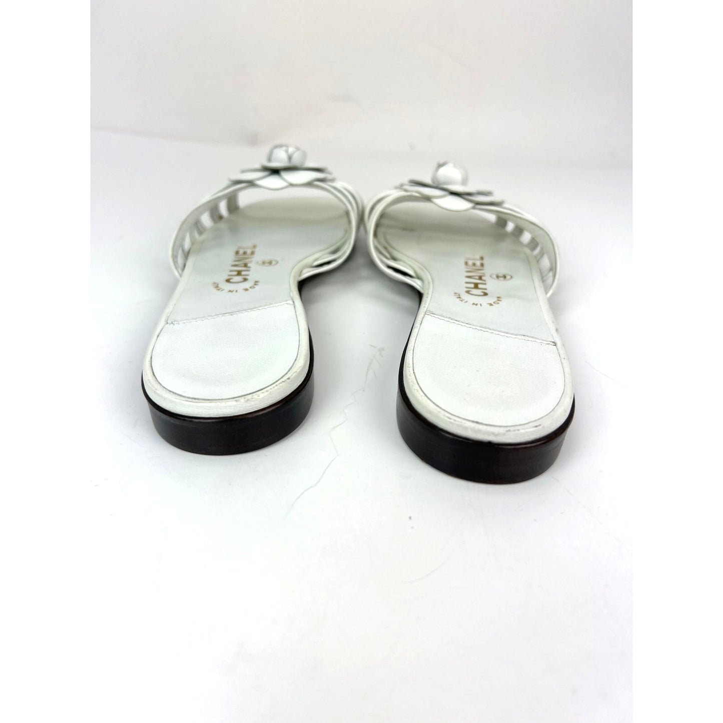 
                  
                    Chanel Cameilla White Leather Slip On Sandals
                  
                