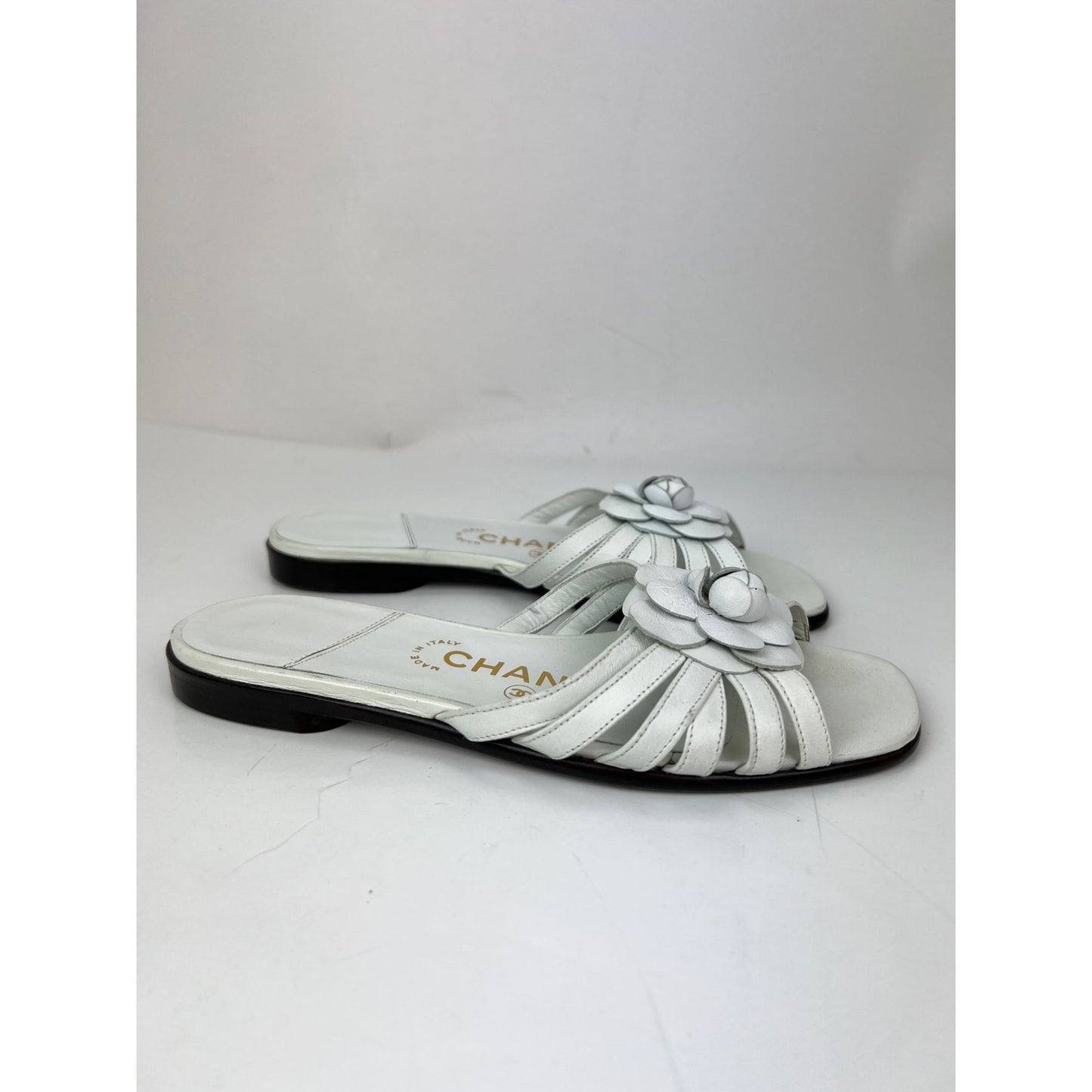 
                  
                    Chanel Cameilla White Leather Slip On Sandals
                  
                
