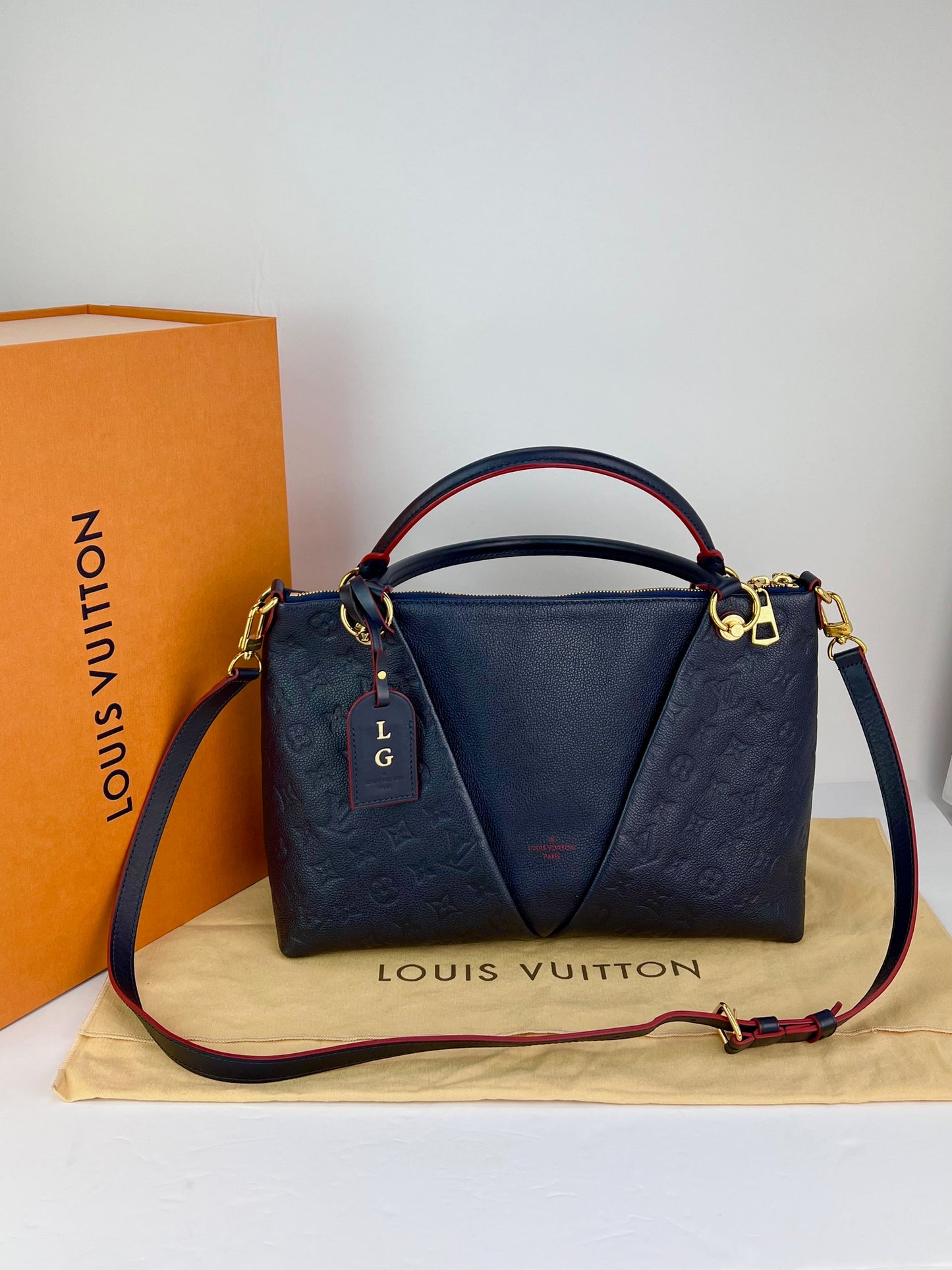 
                  
                    Louis Vuitton V Tote MM Blue Empreinte Leather Shoulder Bag
                  
                