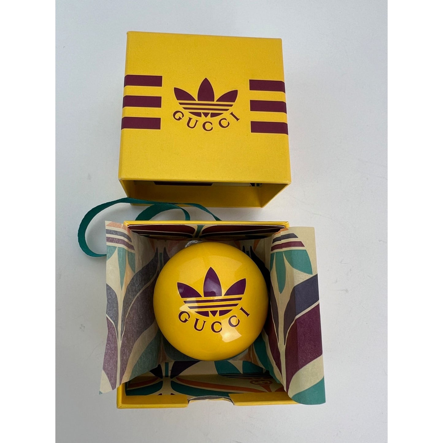 
                  
                    Gucci x Adidas Yellow Wood Yoyo
                  
                