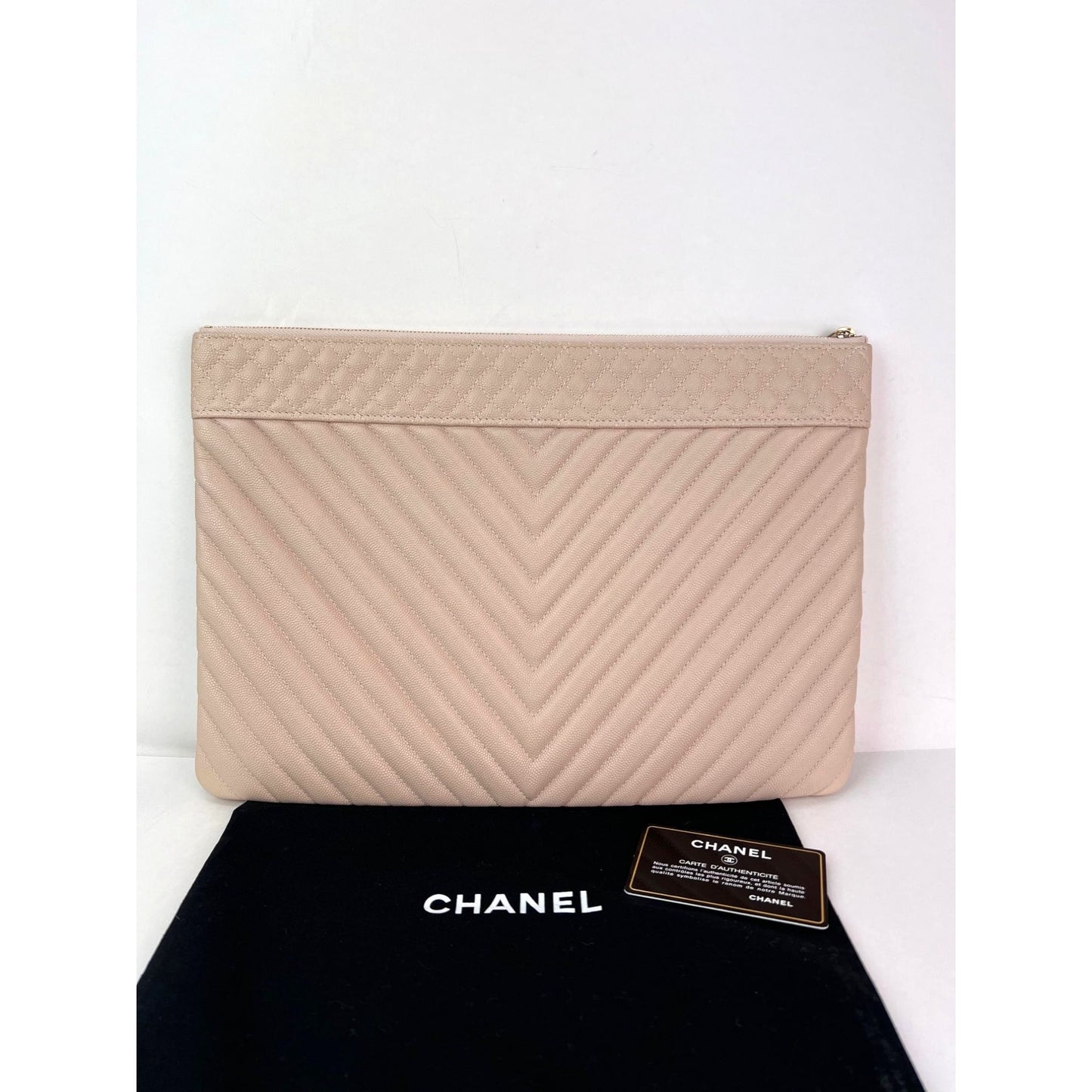 
                  
                    Chanel Caviar Chevron Quilted Large Beige Leather Cosmetic Clutch Bag
                  
                