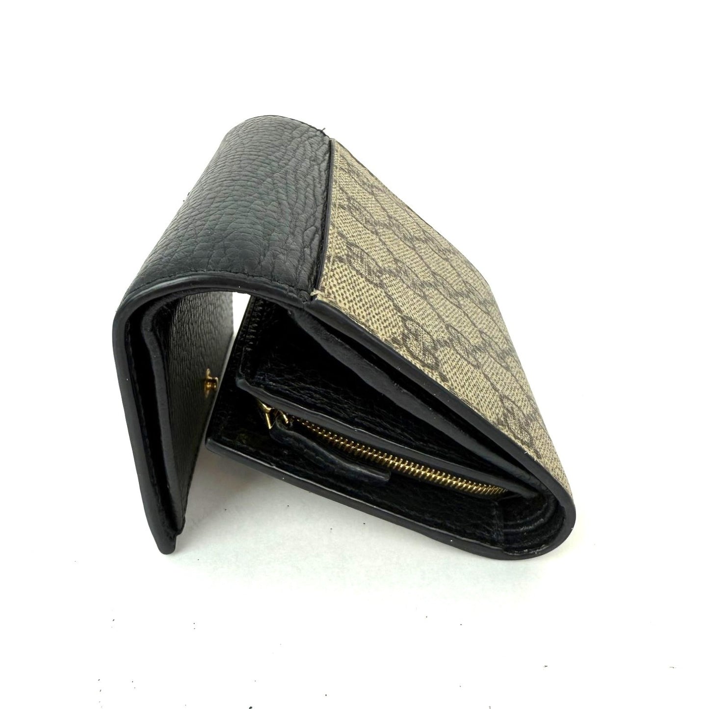 
                  
                    Gucci GG Supreme Compact Black Leather Wallet
                  
                