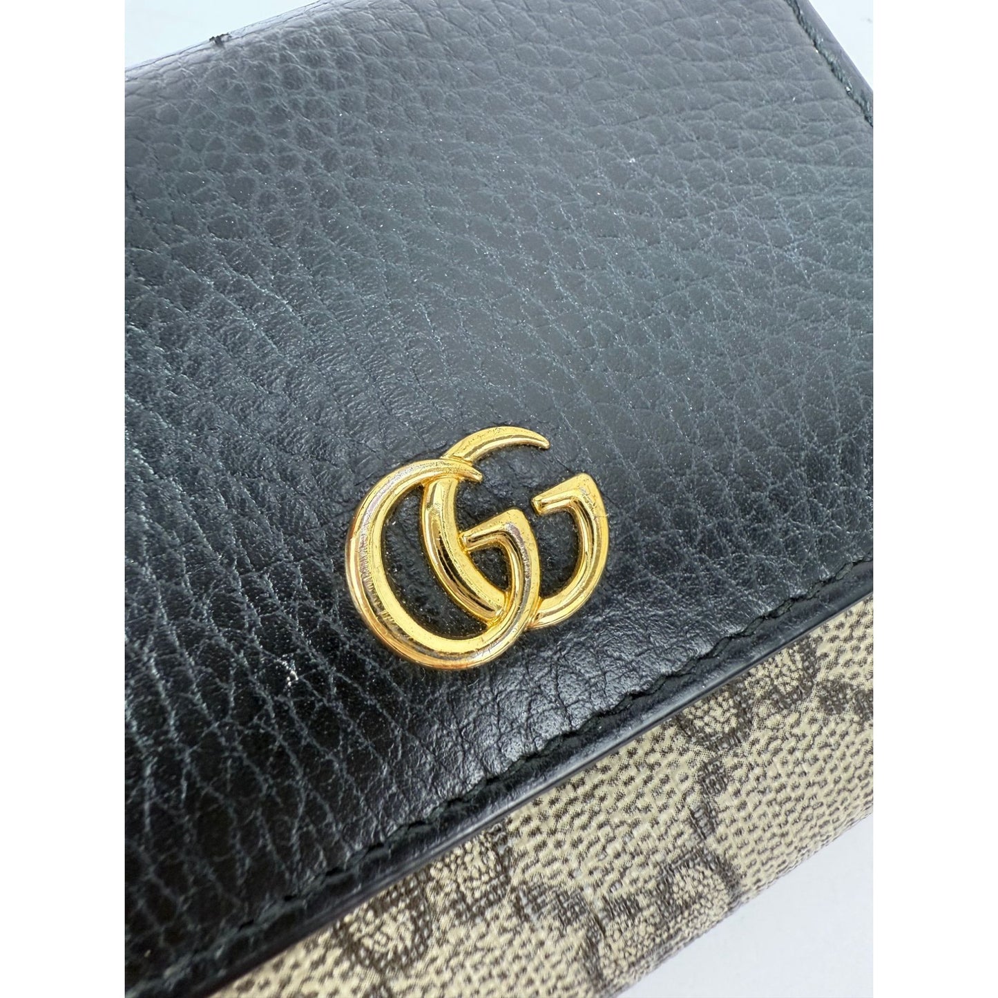 
                  
                    Gucci GG Supreme Compact Black Leather Wallet
                  
                