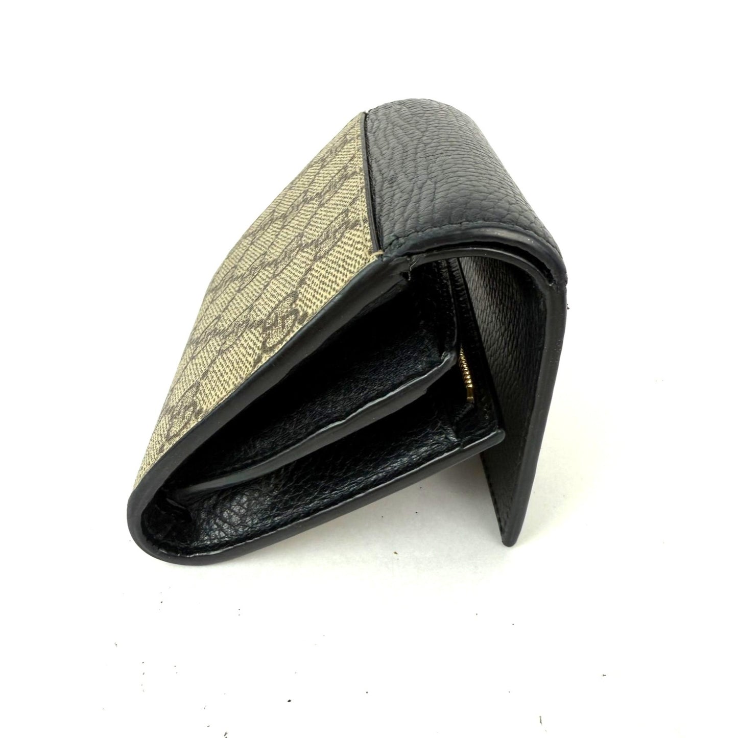 
                  
                    Gucci GG Supreme Compact Black Leather Wallet
                  
                