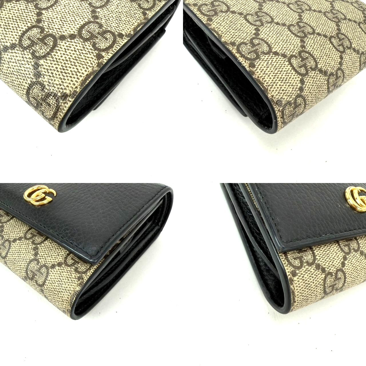 
                  
                    Gucci GG Supreme Compact Black Leather Wallet
                  
                