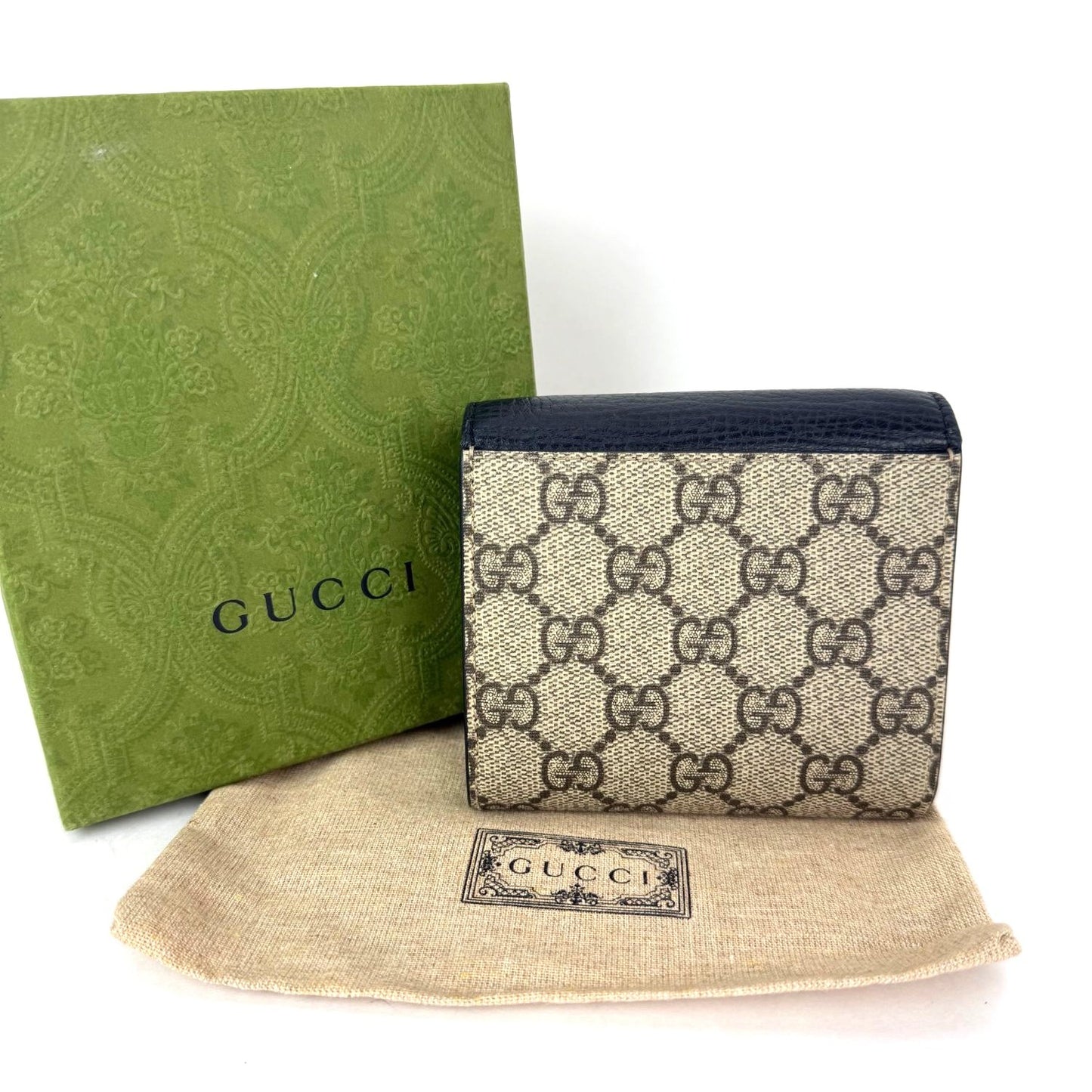 
                  
                    Gucci GG Supreme Compact Black Leather Wallet
                  
                