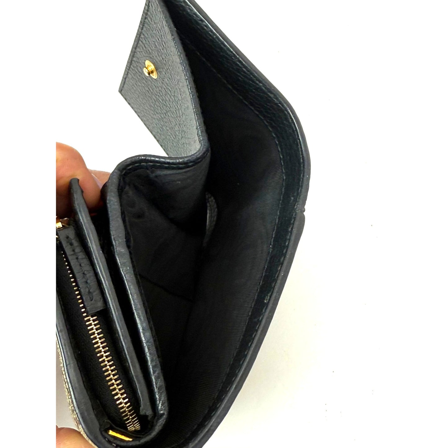 
                  
                    Gucci GG Supreme Compact Black Leather Wallet
                  
                