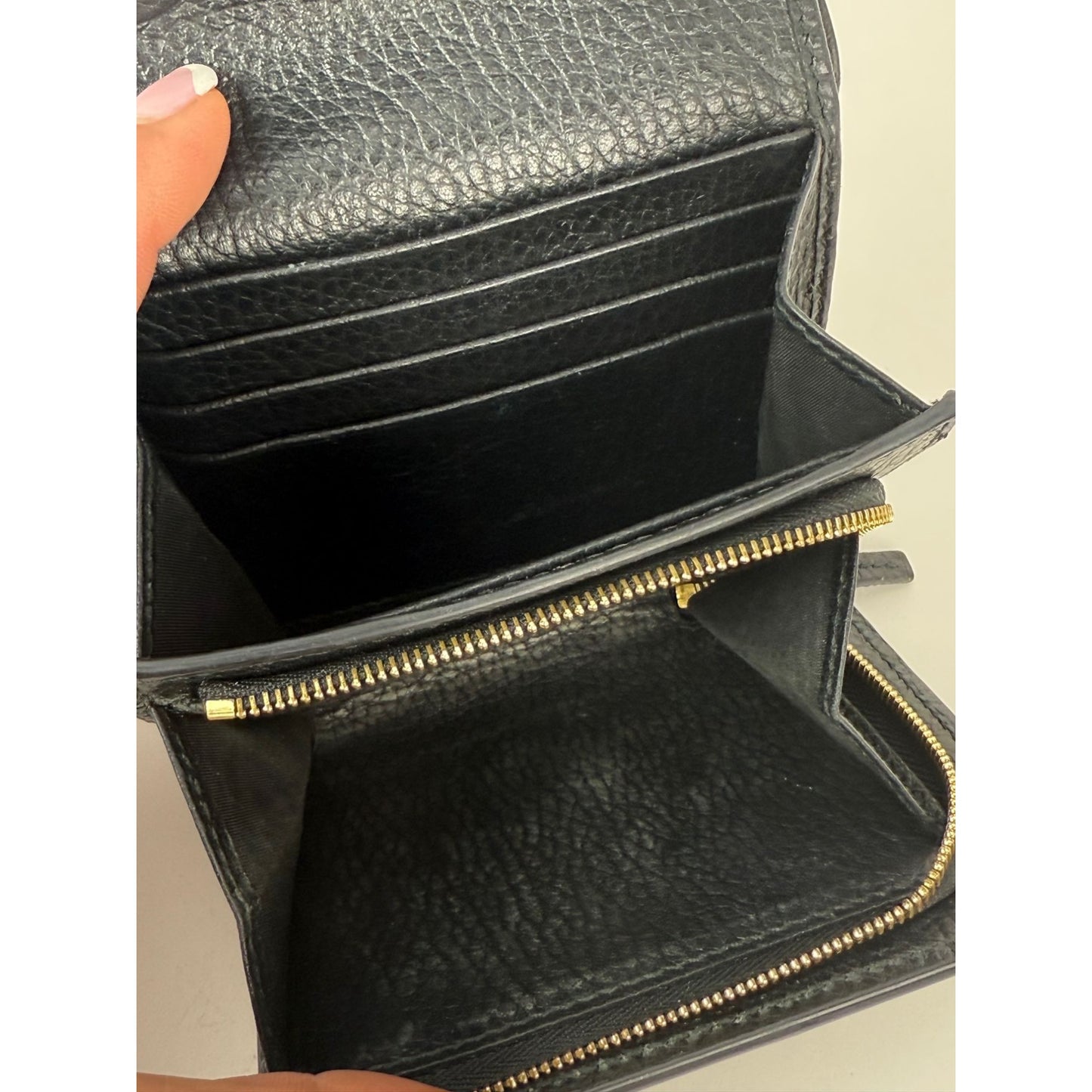 
                  
                    Gucci GG Supreme Compact Black Leather Wallet
                  
                