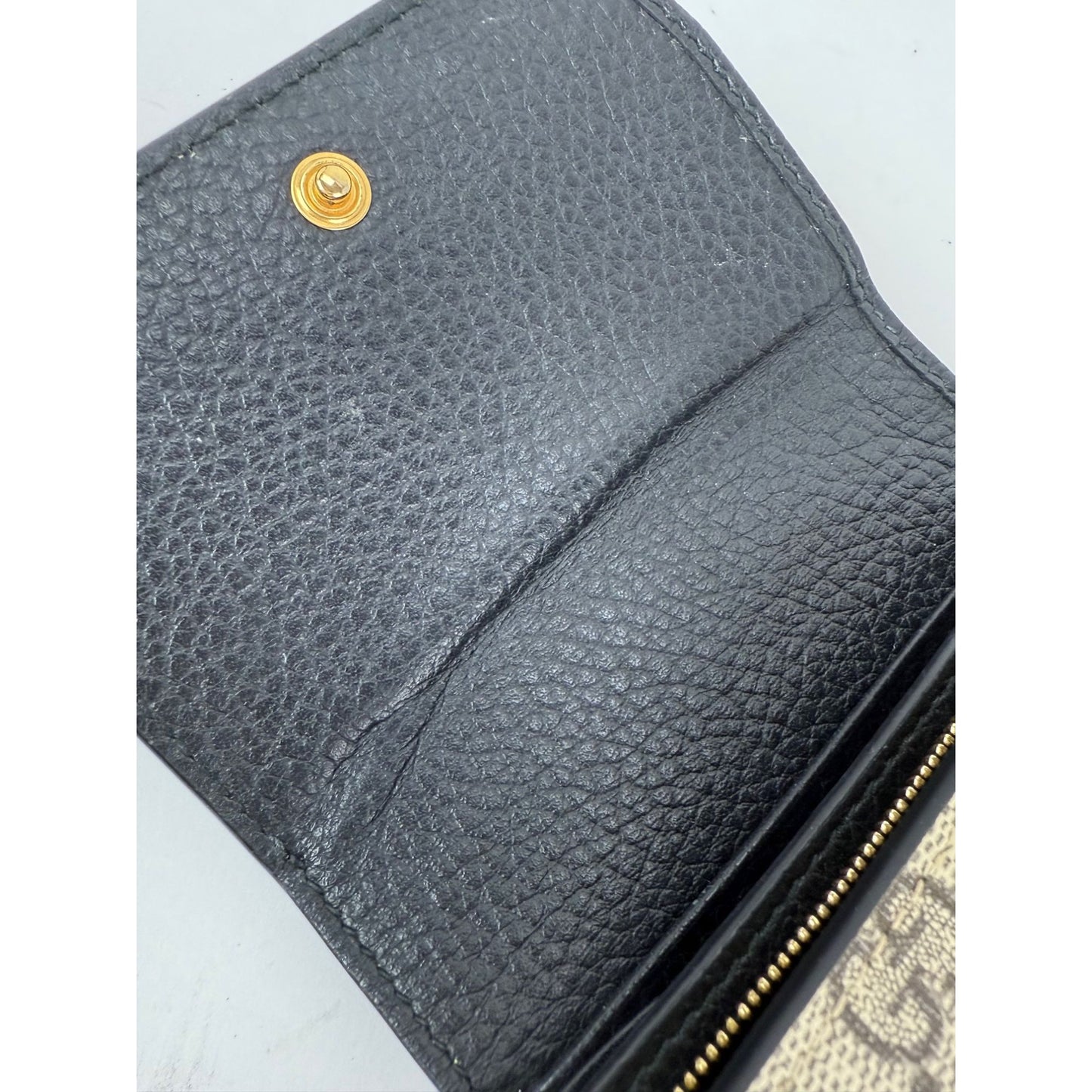 
                  
                    Gucci GG Supreme Compact Black Leather Wallet
                  
                