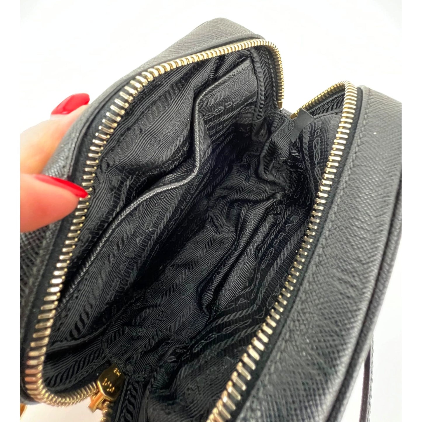 
                  
                    Prada Black Mini Camera Black Saffiano Leather Crossbody Bag
                  
                