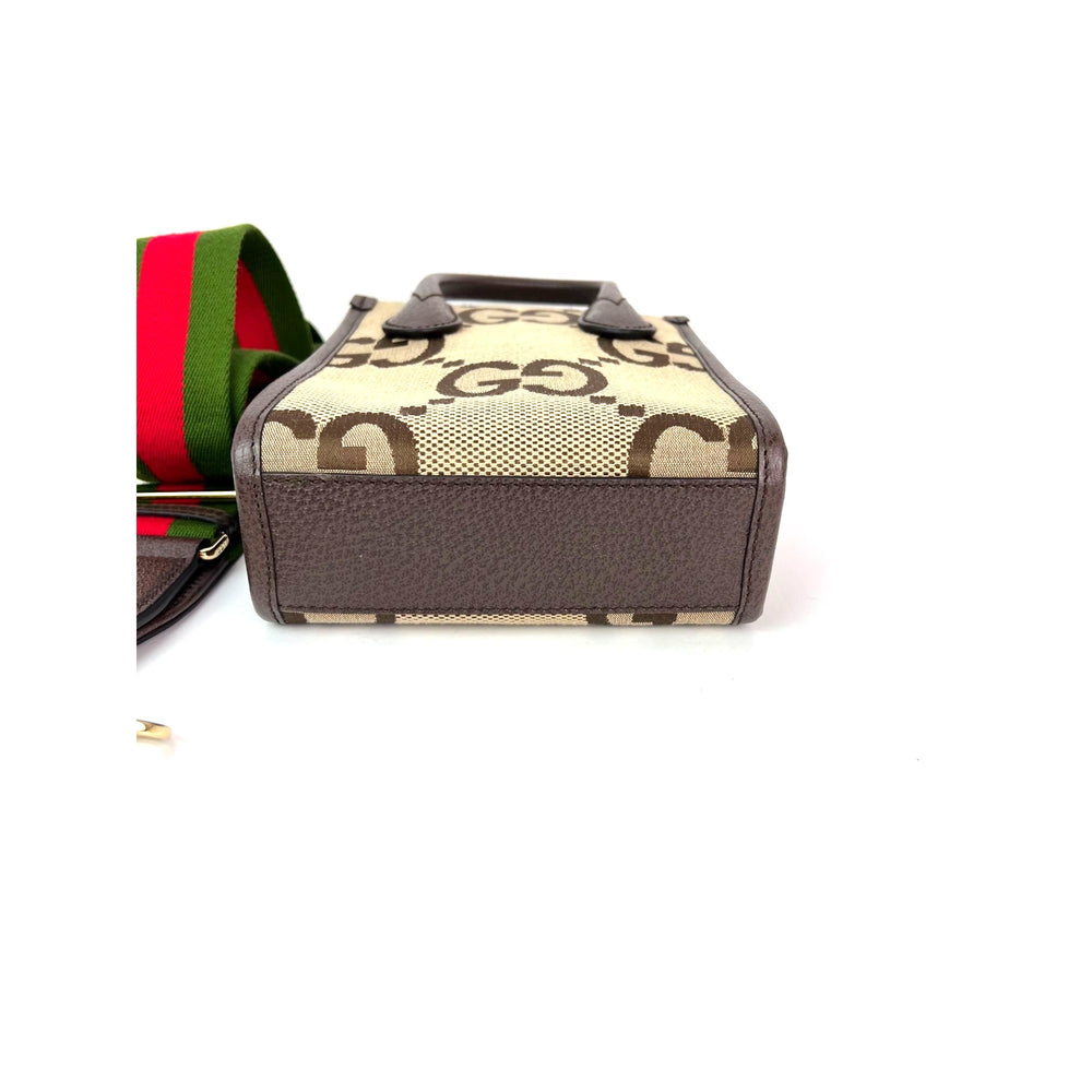 
                  
                    Gucci Jumbo GG textured dollar calfskin Mini Web Vertical Tote
                  
                