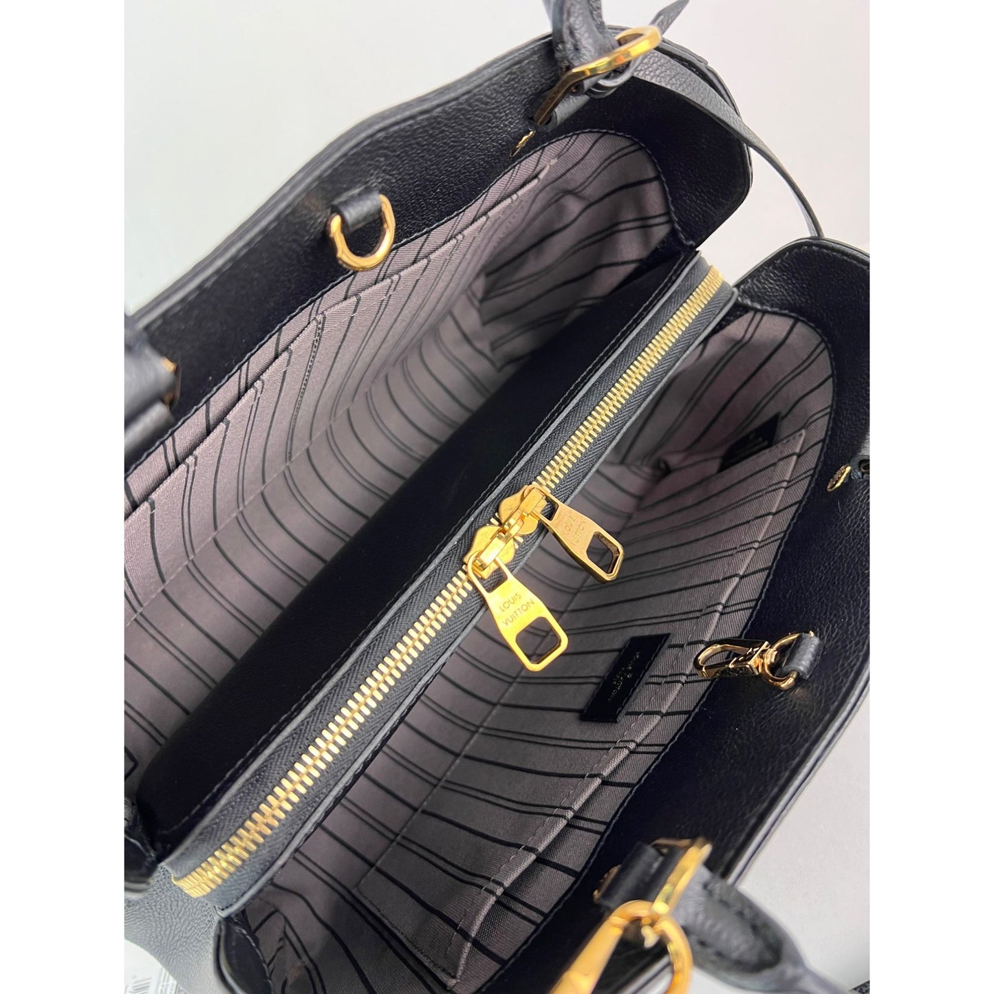 
                  
                    Louis Vuitton Montaigne MM Empreinte Black Leather Shoulder Bag
                  
                
