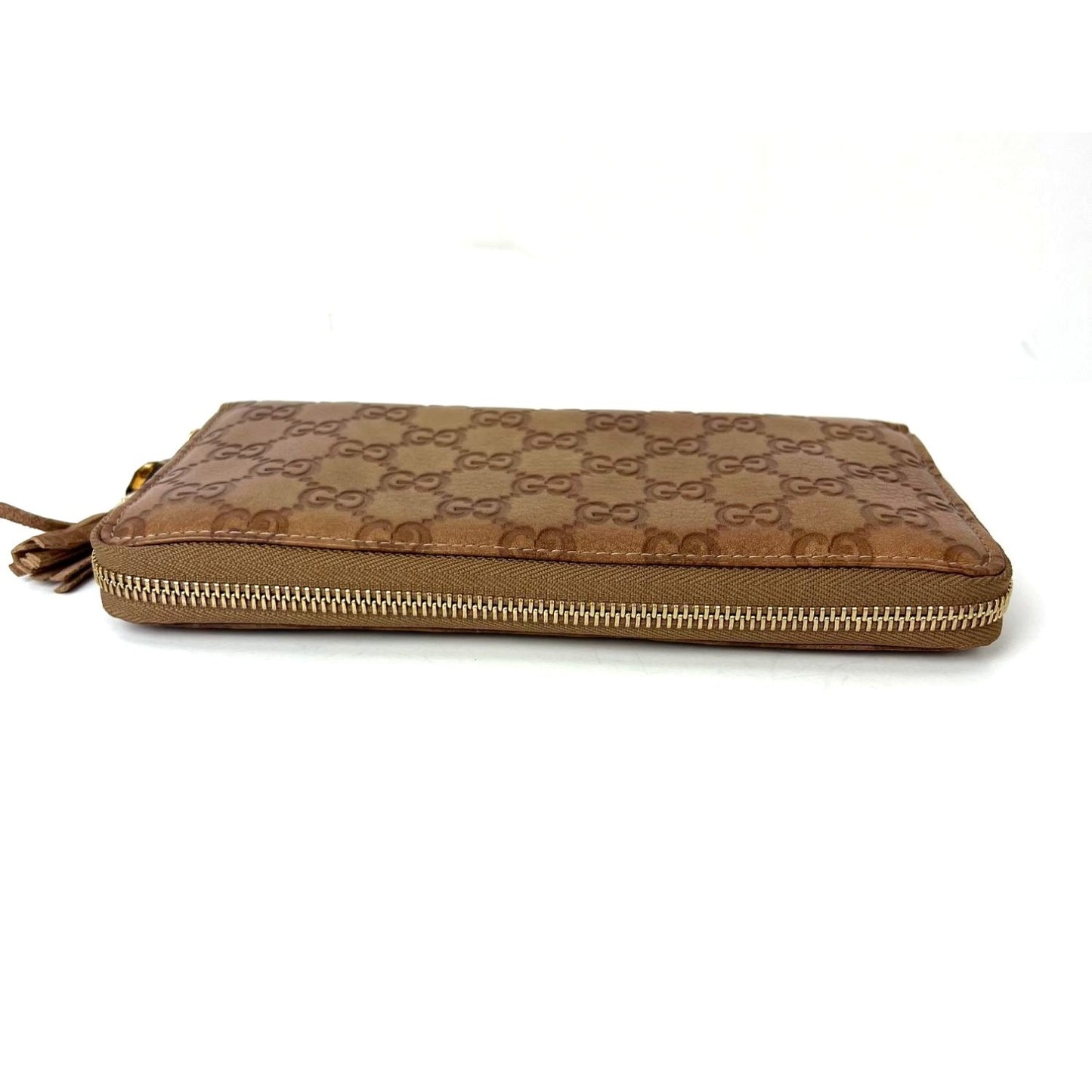 
                  
                    Gucci GG Guccisima Leather Bamboo Tassel Zippy Wallet Clutch
                  
                