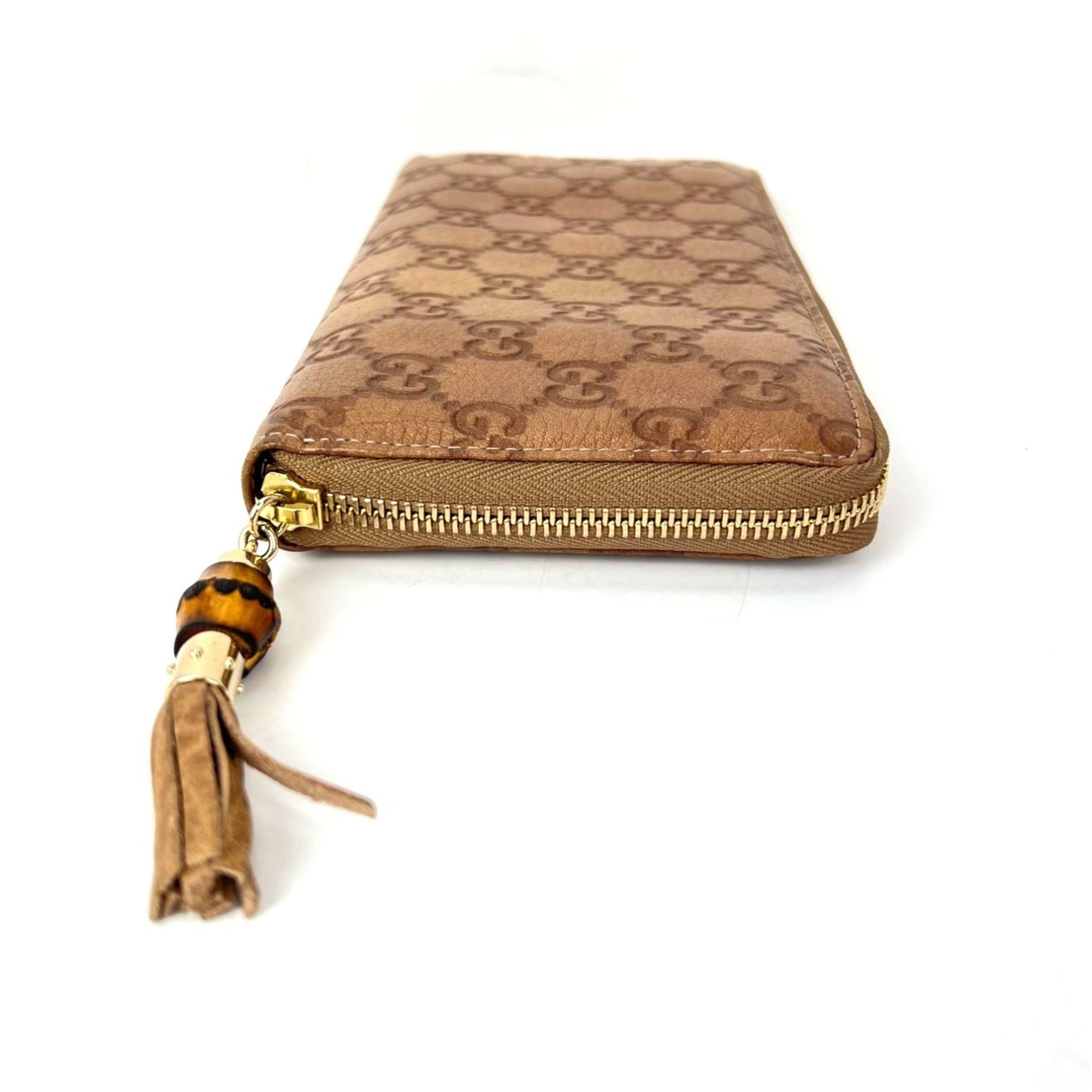 
                  
                    Gucci GG Guccisima Leather Bamboo Tassel Zippy Wallet Clutch
                  
                