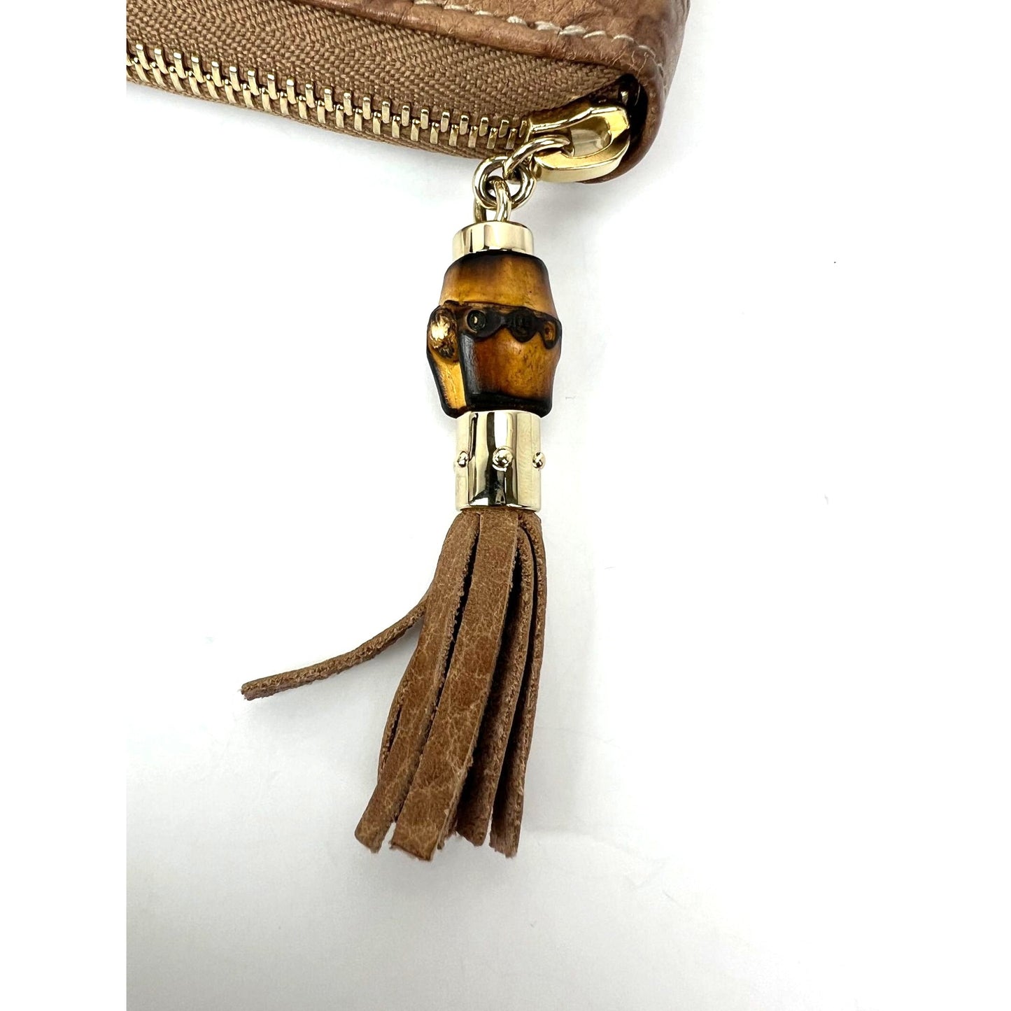
                  
                    Gucci GG Guccisima Leather Bamboo Tassel Zippy Wallet Clutch
                  
                