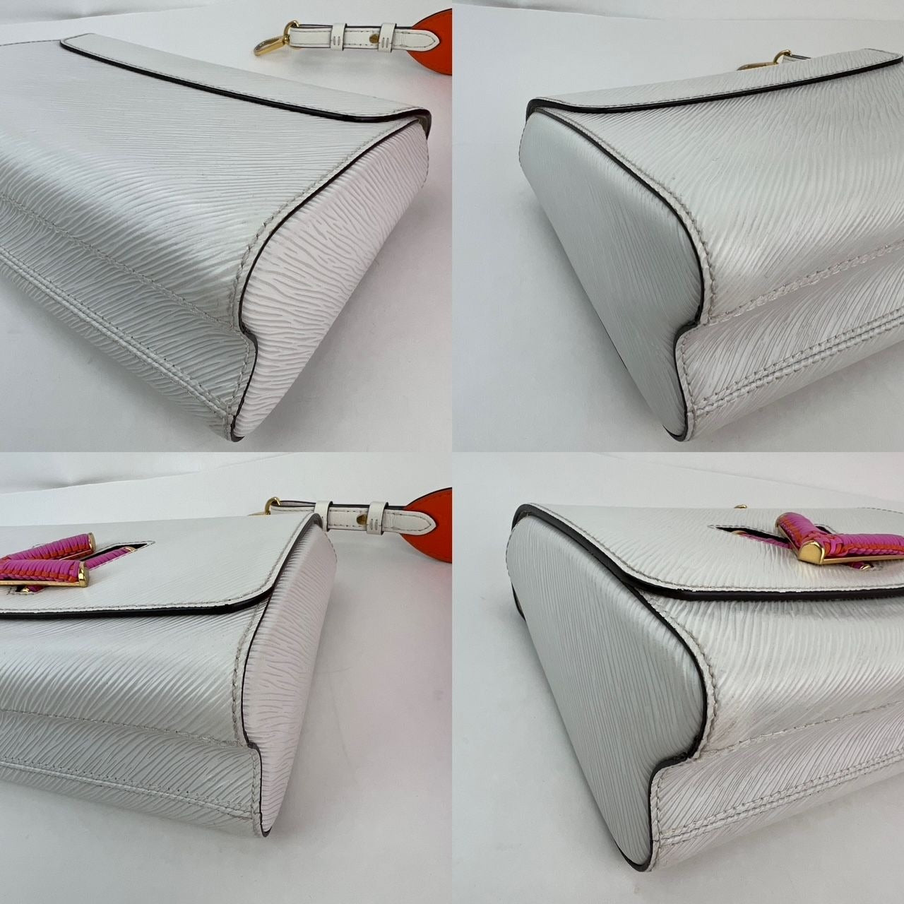 
                  
                    Louis Vuitton Epi White Twist MM Shoulder Bag
                  
                