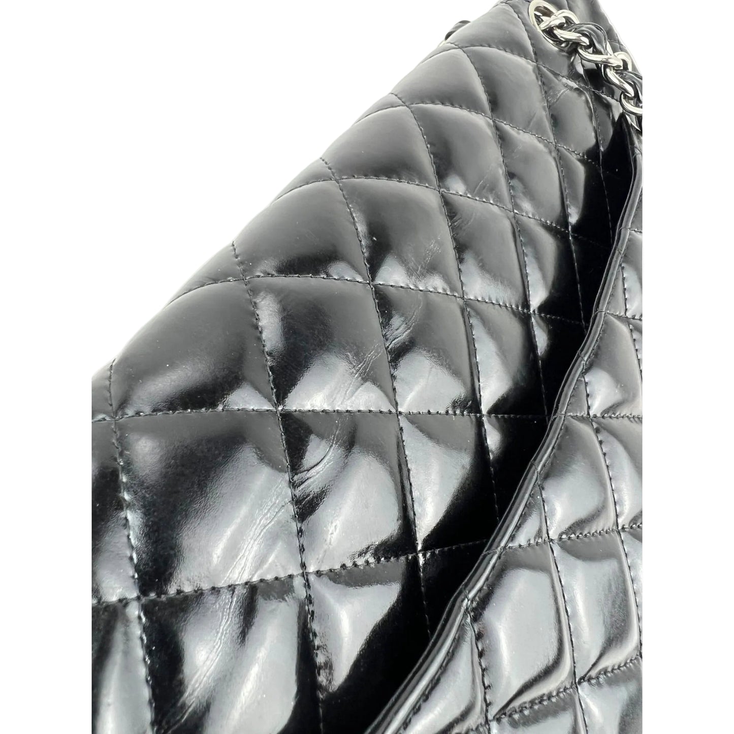 
                  
                    Chanel Double Flap Black Patent Leather Maxi Shoulder Bag
                  
                