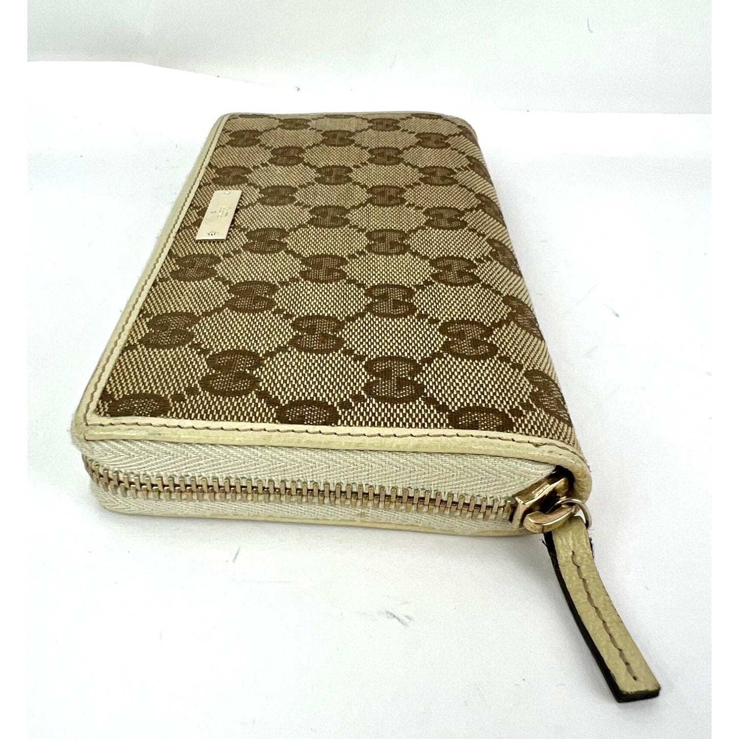 
                  
                    Gucci GG Logo Beige Zip Around Canvas Wallet
                  
                
