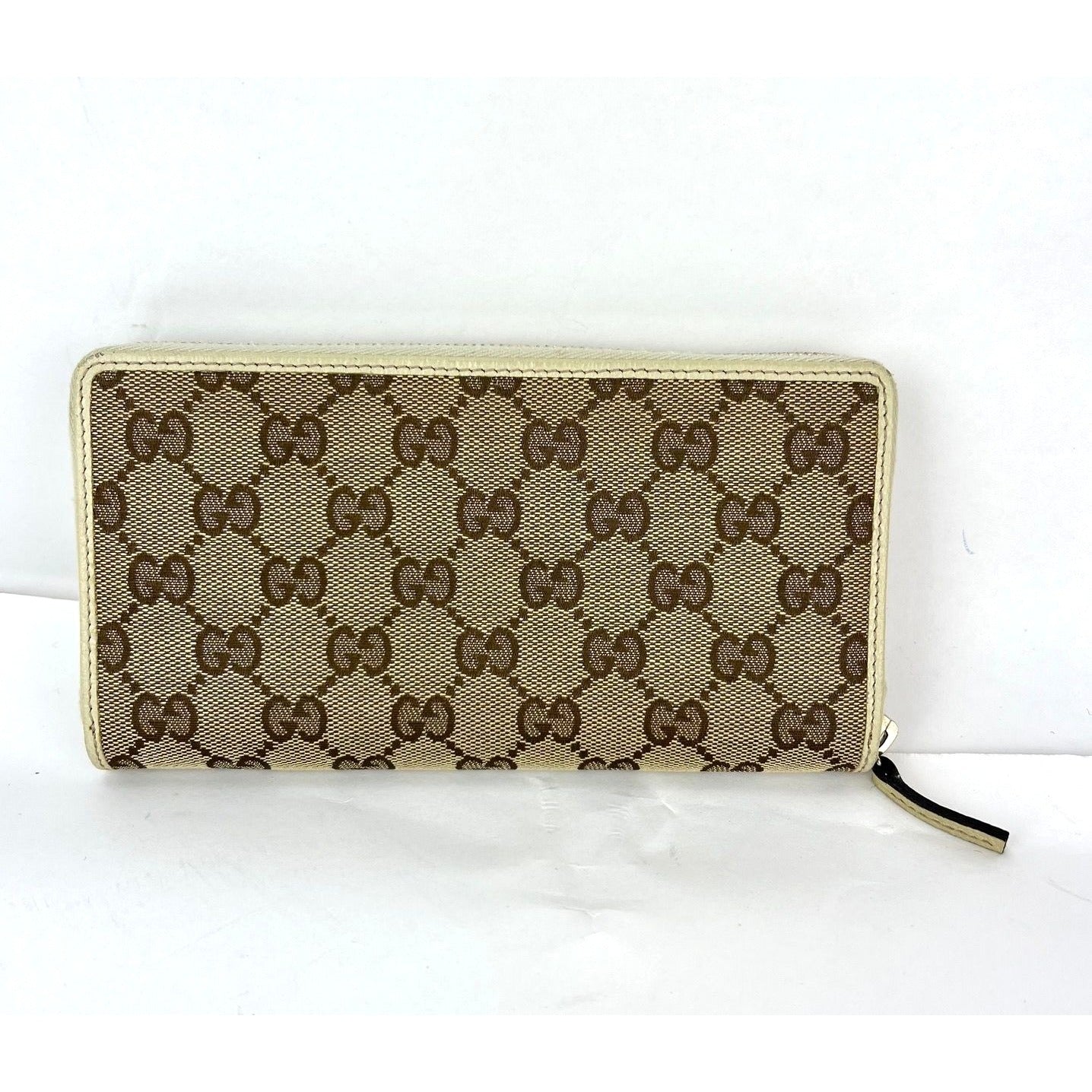 
                  
                    Gucci GG Logo Beige Zip Around Canvas Wallet
                  
                