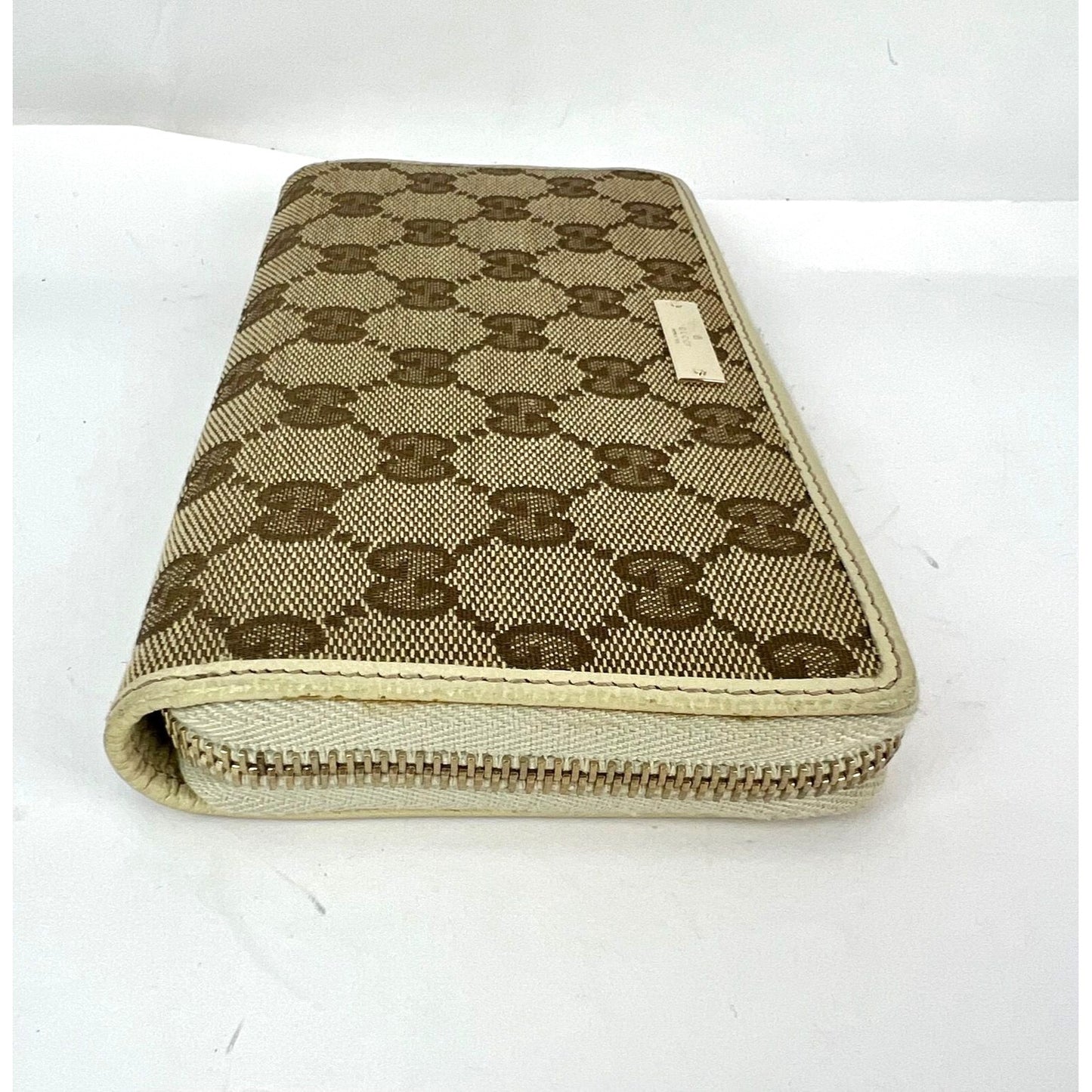 
                  
                    Gucci GG Logo Beige Zip Around Canvas Wallet
                  
                