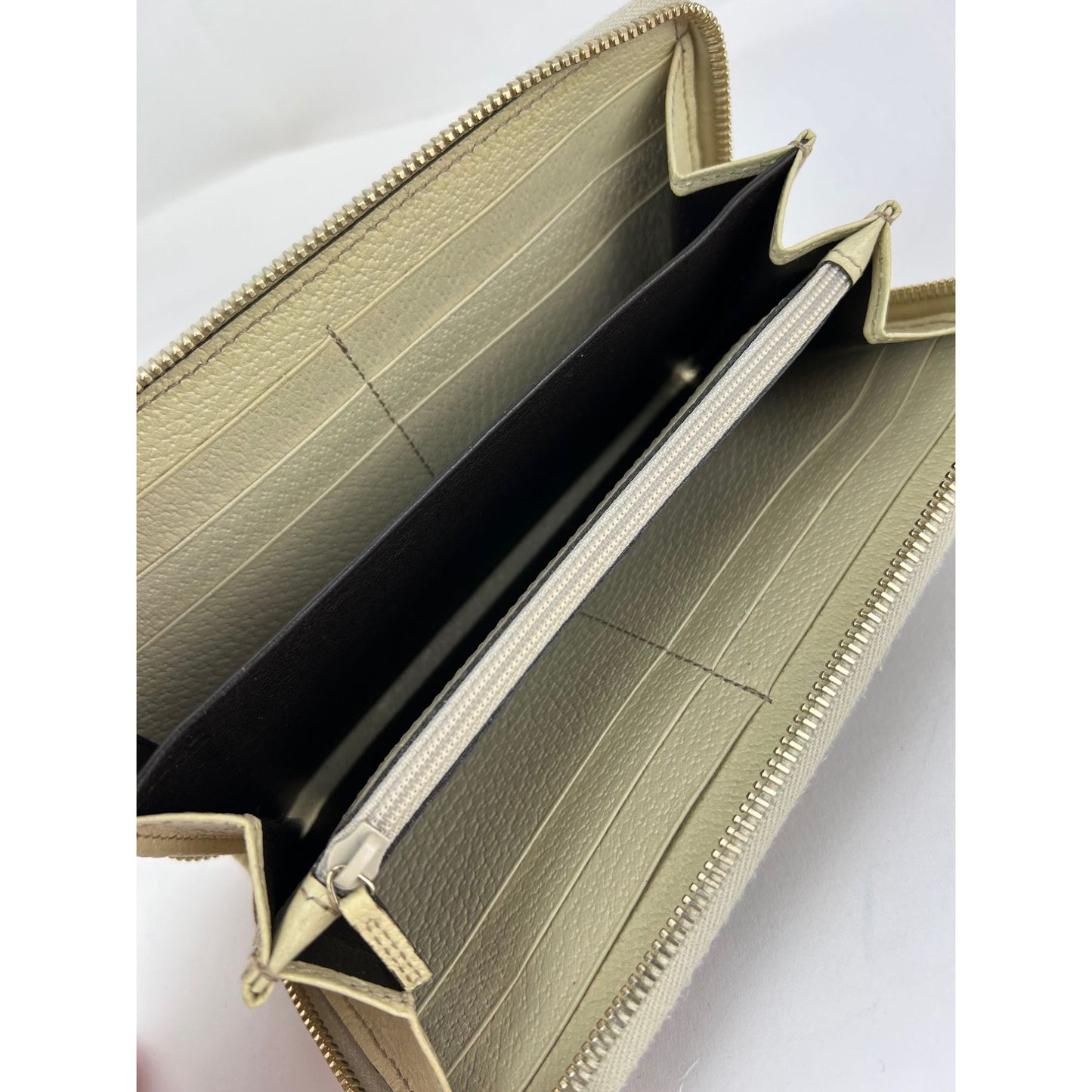 
                  
                    Gucci GG Logo Beige Zip Around Canvas Wallet
                  
                