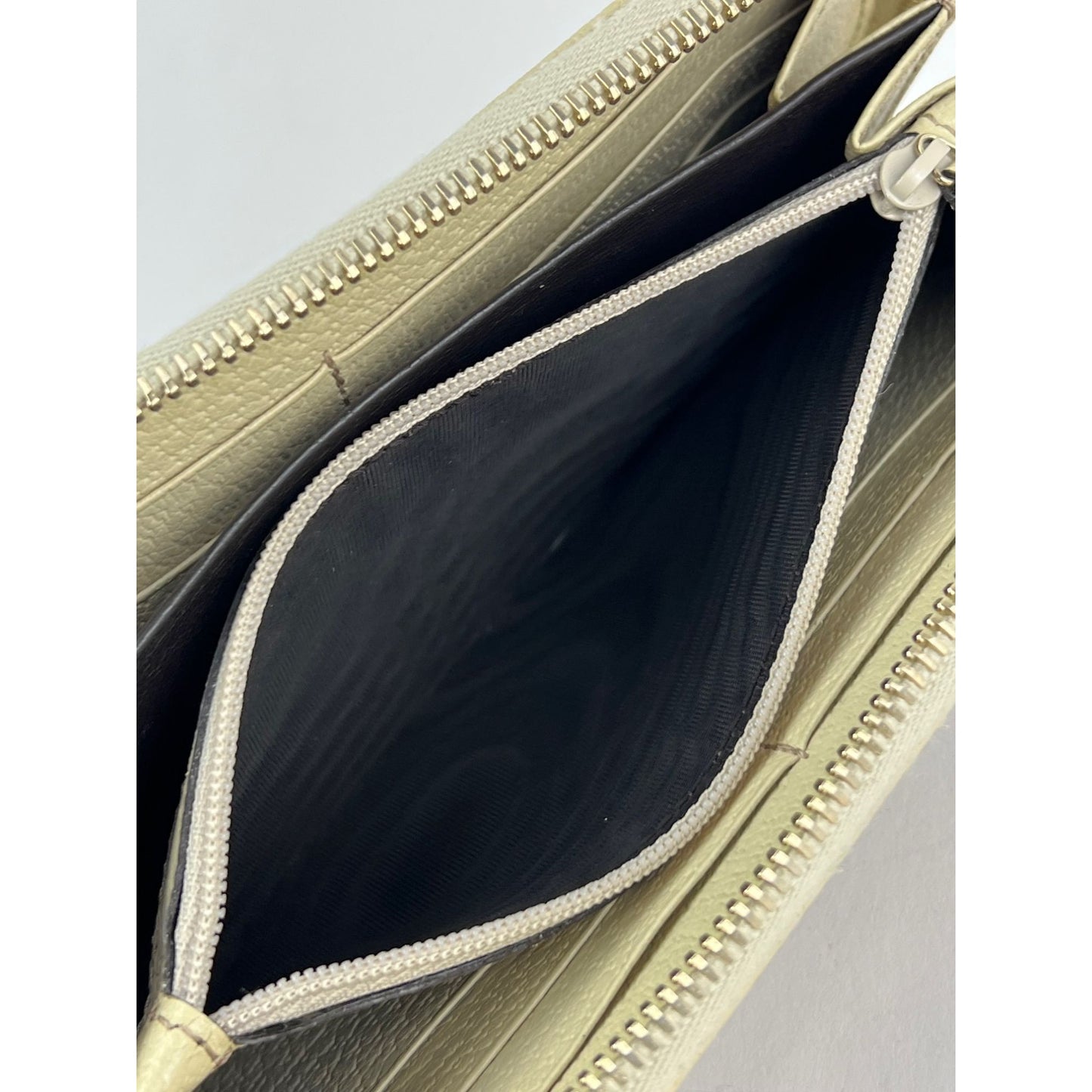 
                  
                    Gucci GG Logo Beige Zip Around Canvas Wallet
                  
                