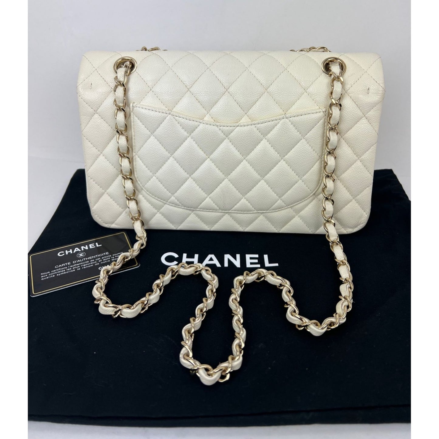 
                  
                    Chanel Caviar Quilted Medium Double Flap White Shoulder Bag
                  
                