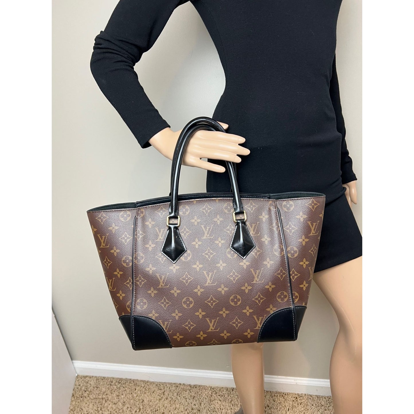
                  
                    Louis Vuitton Phenix Monogram Leather Tote Bag
                  
                