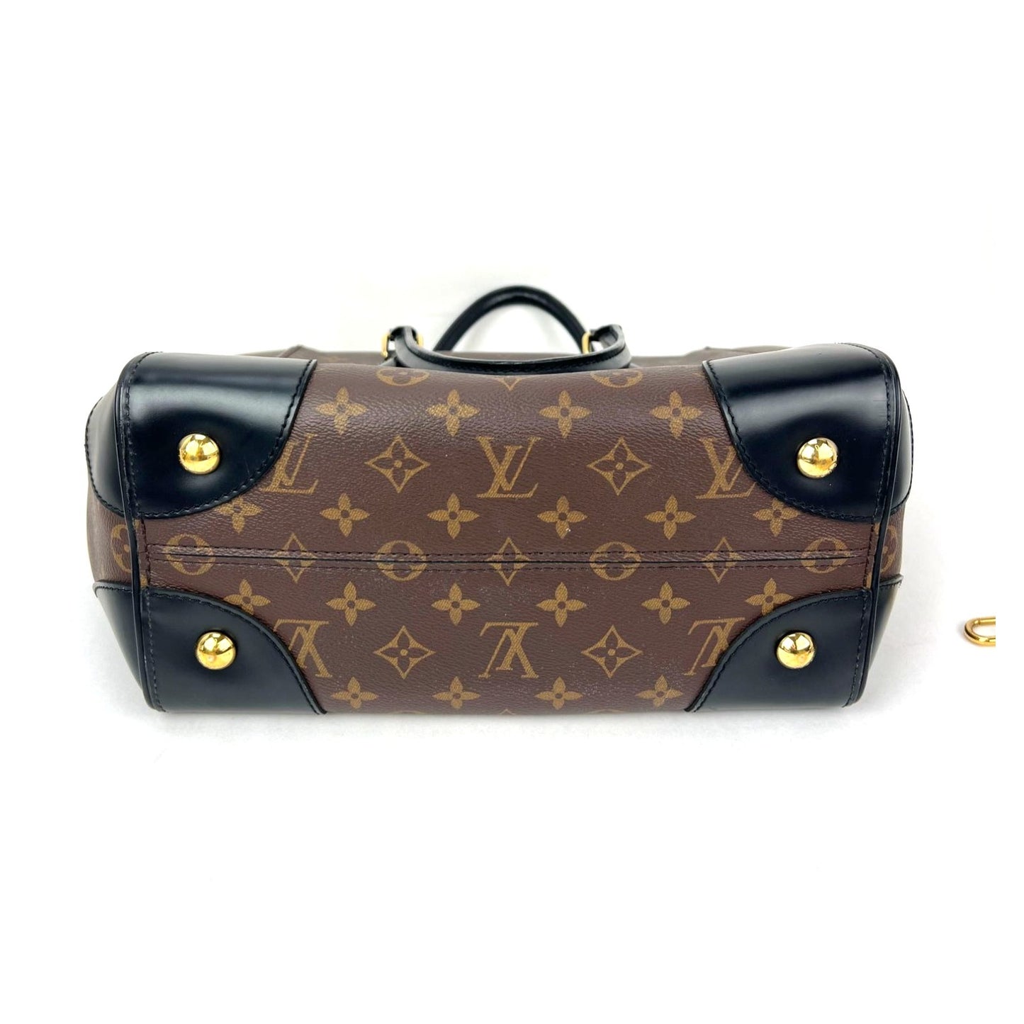 
                  
                    Louis Vuitton Phenix Monogram Leather Tote Bag
                  
                