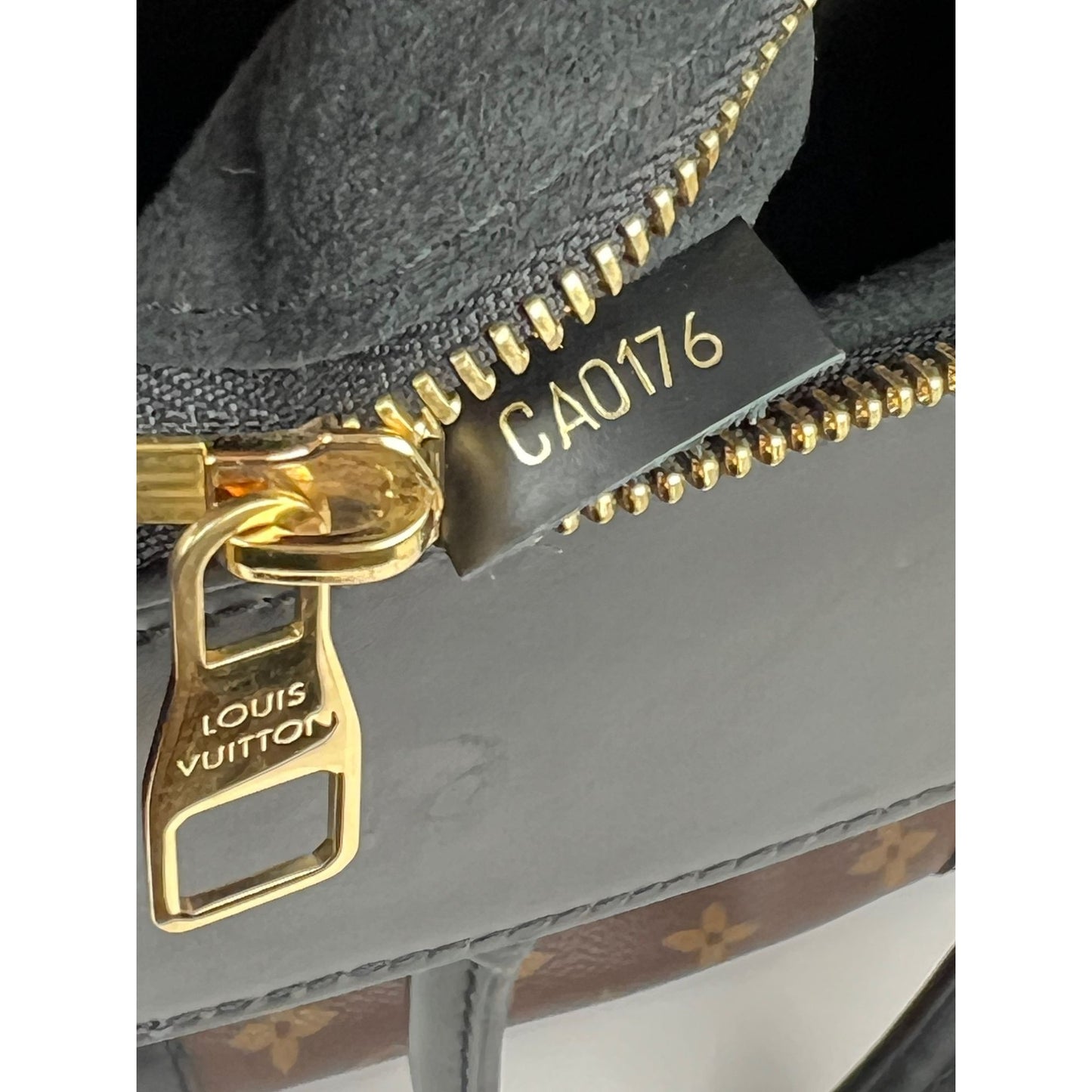 
                  
                    Louis Vuitton Phenix Monogram Leather Tote Bag
                  
                