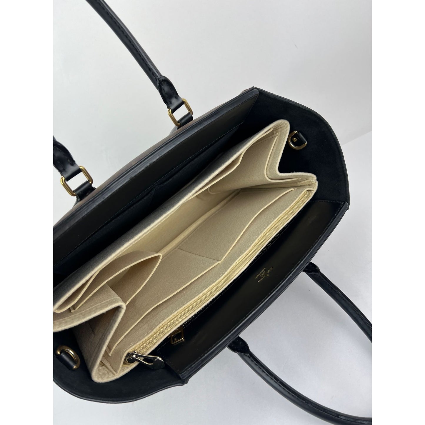 
                  
                    Louis Vuitton Phenix Monogram Leather Tote Bag
                  
                